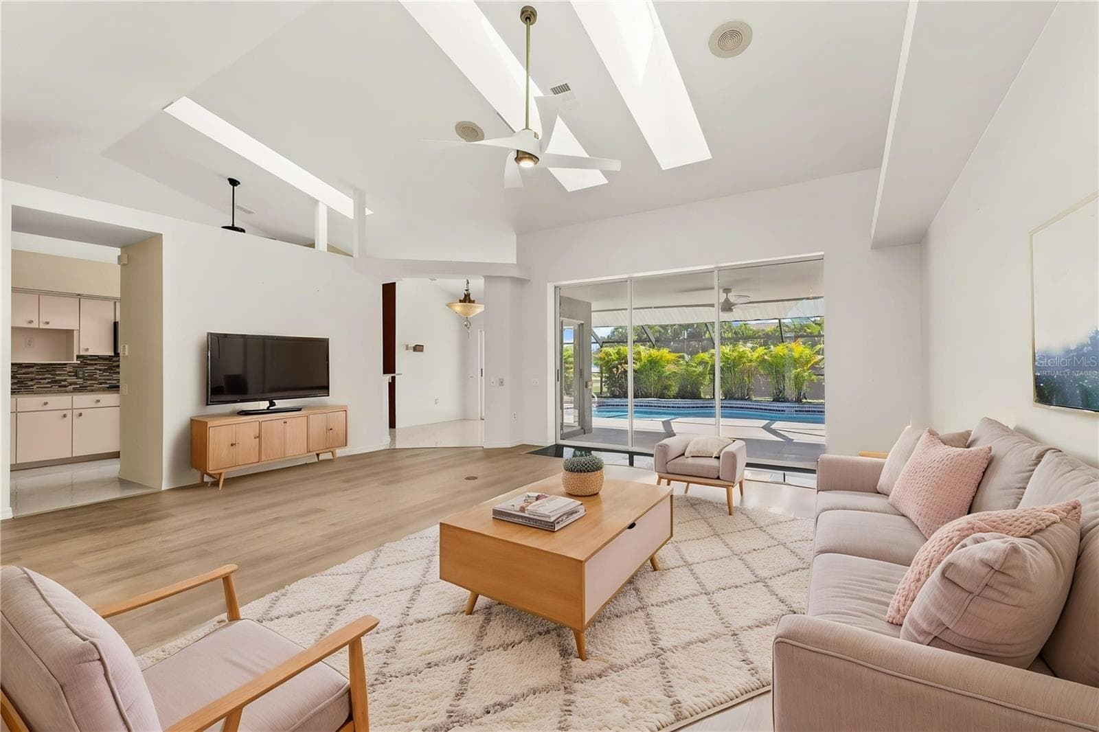 Living room virtually staged - 5184 ELLSWORTH TER, PORT CHARLOTTE