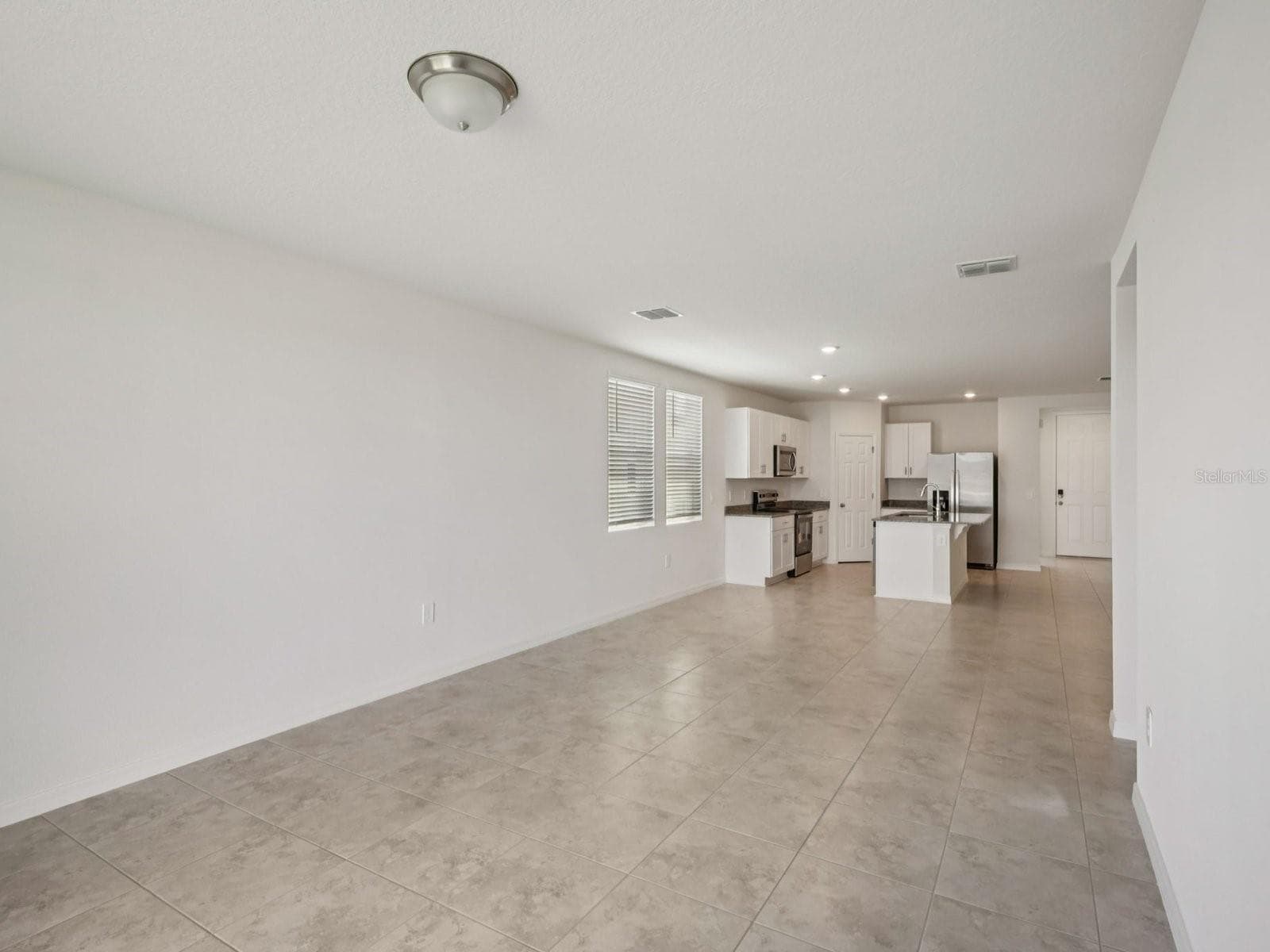 Can you make this description for VillaMar for MLS with a warm but sales appeal: This versatile floorplan offers four bedrooms, two full baths and family room, complemented by an open-concept kitchen, dining area, and great room designed for gathering and entertaining. - 3965 GIORGIO DR, WINTER HAVEN