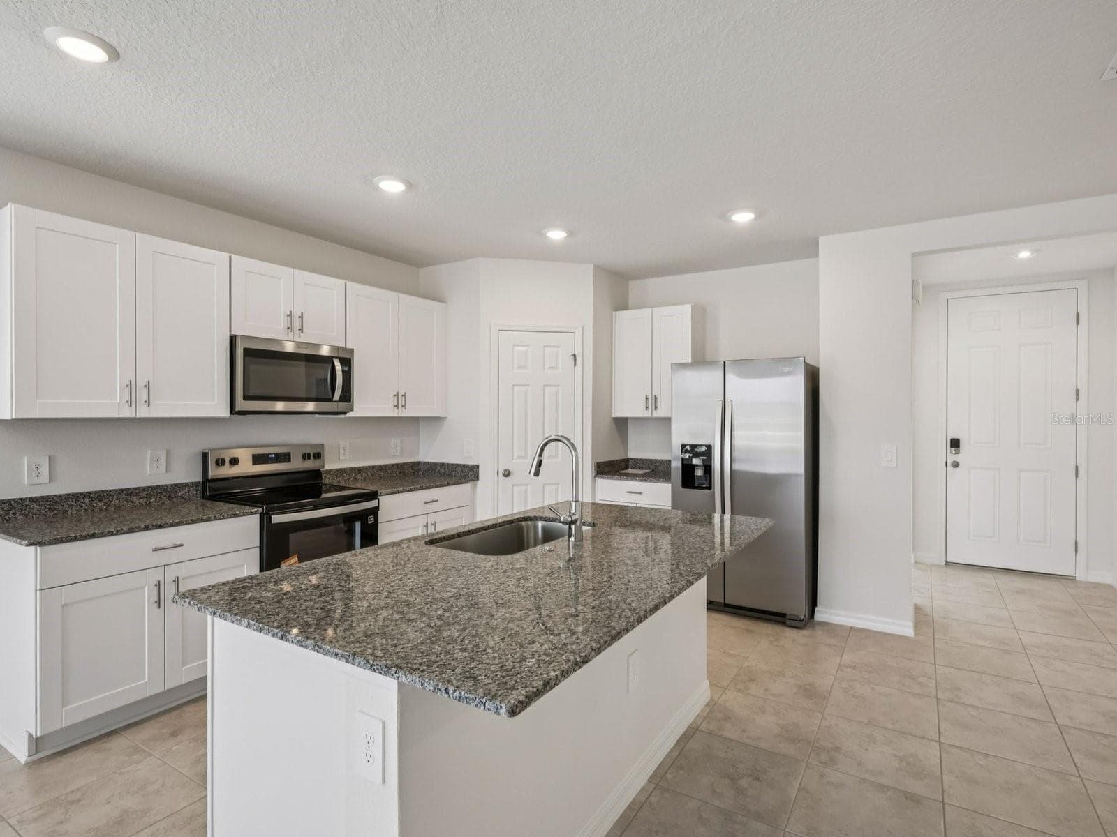 Can you make this description for VillaMar for MLS with a warm but sales appeal: This versatile floorplan offers four bedrooms, two full baths and family room, complemented by an open-concept kitchen, dining area, and great room designed for gathering and entertaining. - 3965 GIORGIO DR, WINTER HAVEN