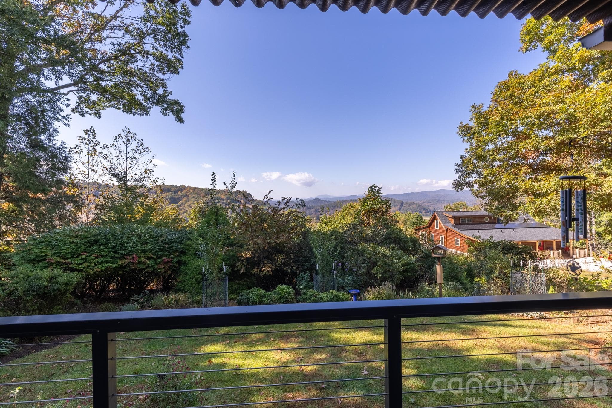 Enjoy picturesque long-range Blue Ridge Mountain views from the rear deck. - 524 Three Mile Knob Road, Pisgah Forest