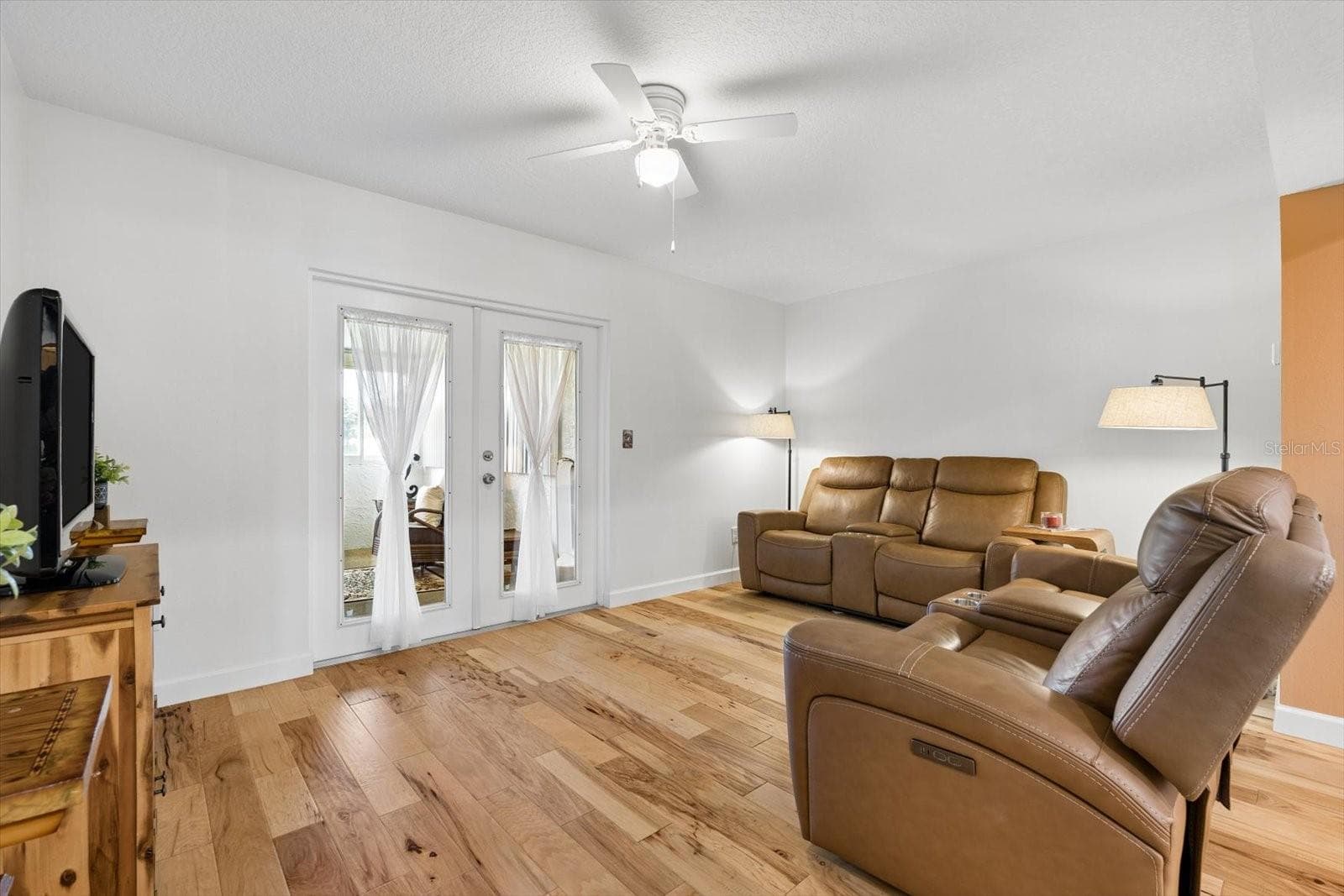 Living with French Doors to closed in porch - 172 115TH AVE N #172, ST PETERSBURG