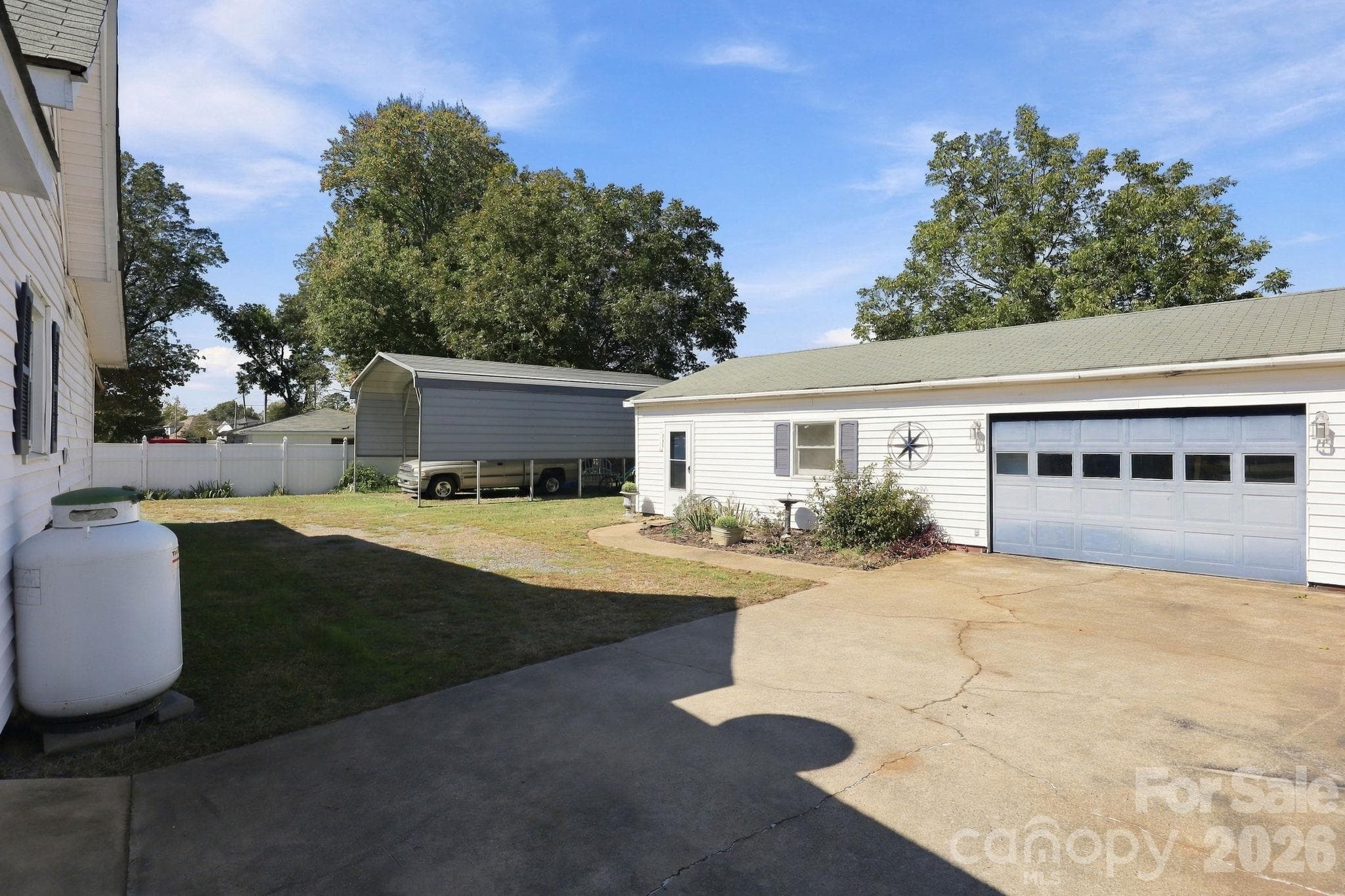 Detached 984 square ft garage features bonus room perfect for hobbies or a workshop- - 613 Salisbury Street, China Grove