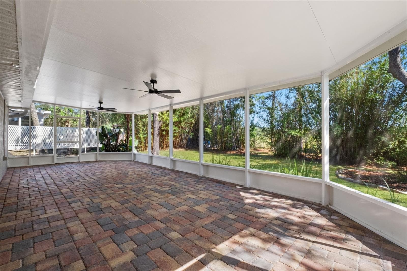 Expansive Screened Rear Porch with Pavers - 2138 FAIRVIEW RD, SPRING HILL