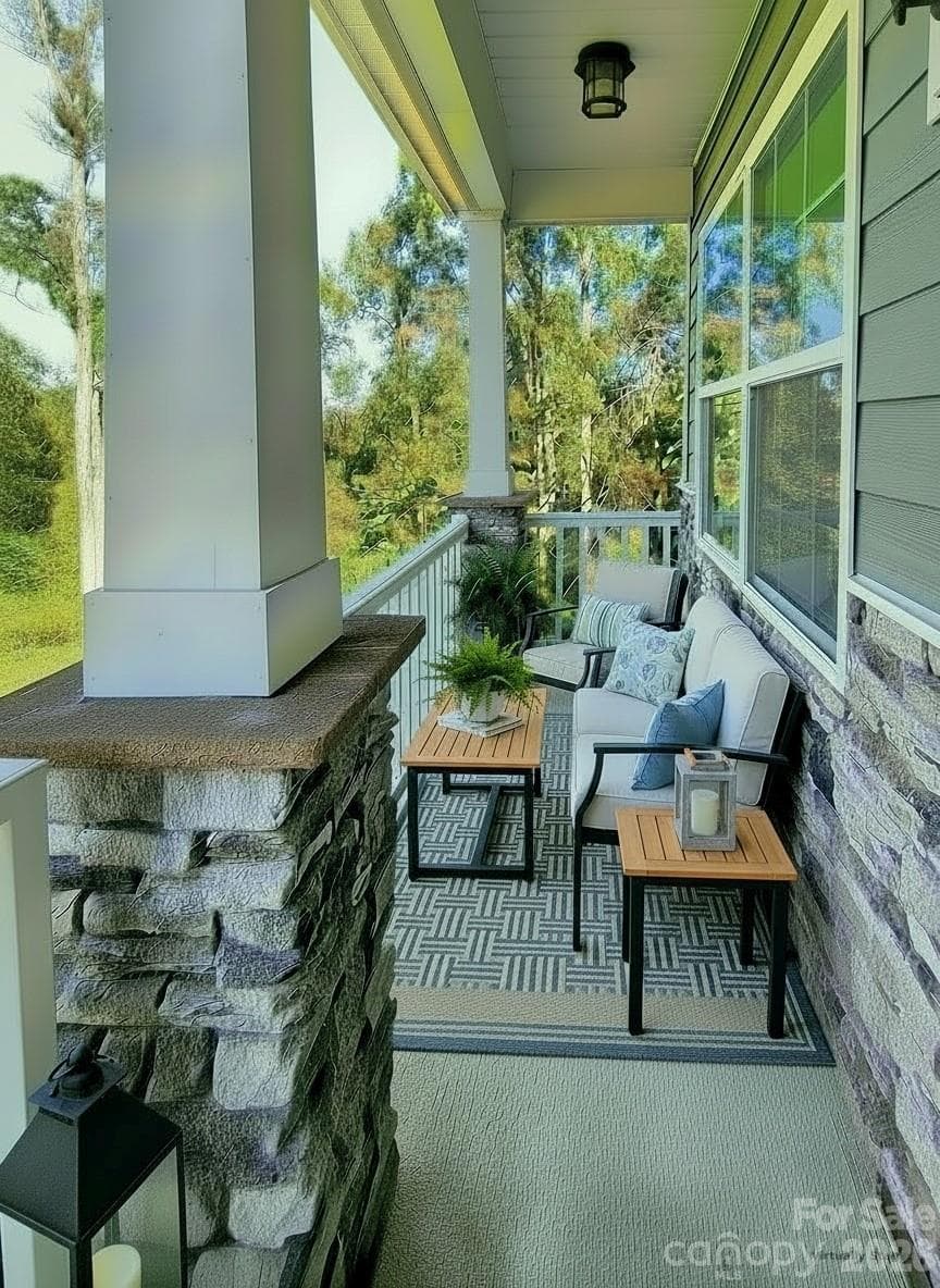 Front porch with vinyl handrails and spindles. - 3741 Stanley Creek Drive, Mount Holly