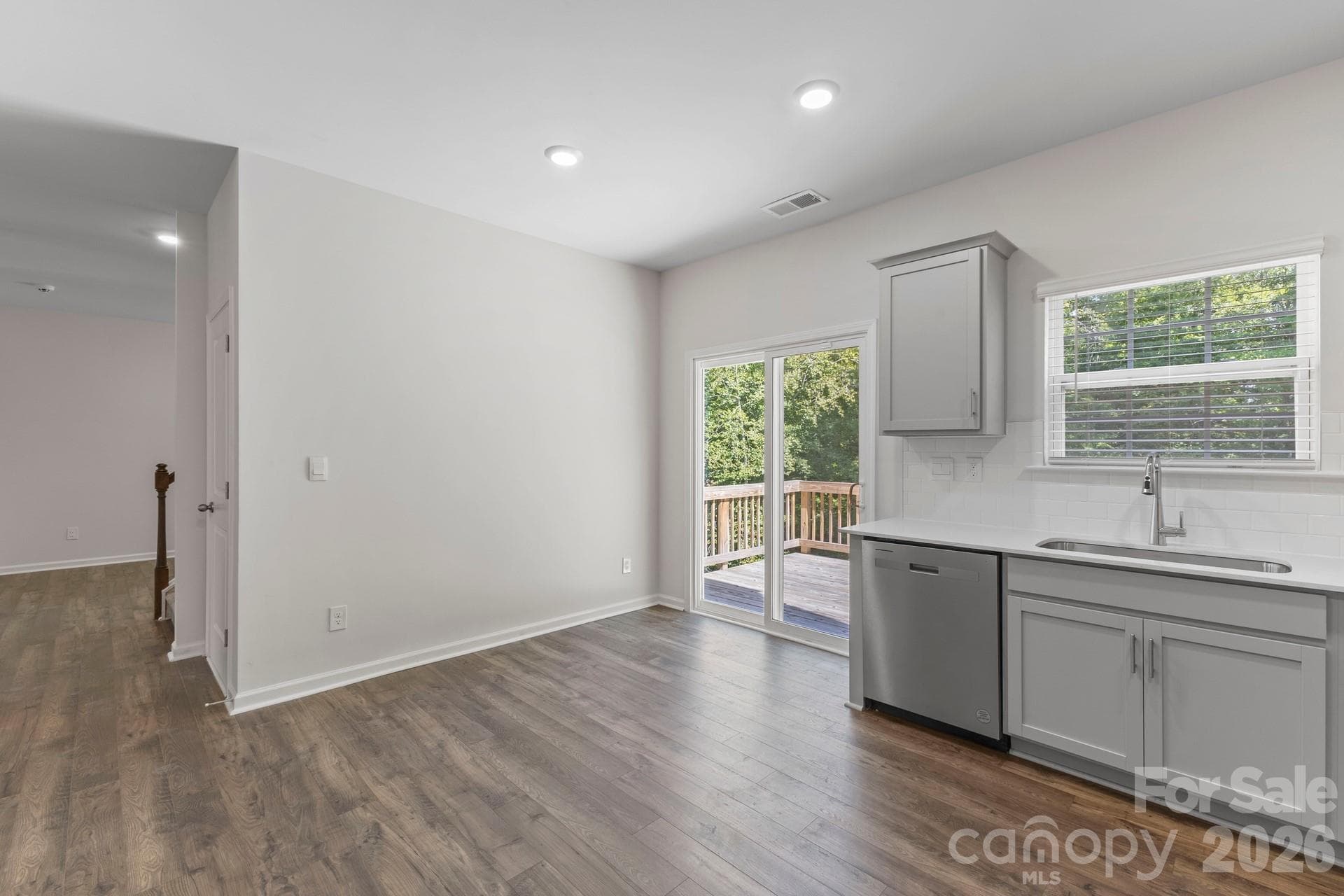 Eating area The eat-in kitchen area seamlessly connects indoor and outdoor living, with sliding glass doors leading to a rear deck overlooking the private, wooded backyard.in kitchen. - 3741 Stanley Creek Drive, Mount Holly