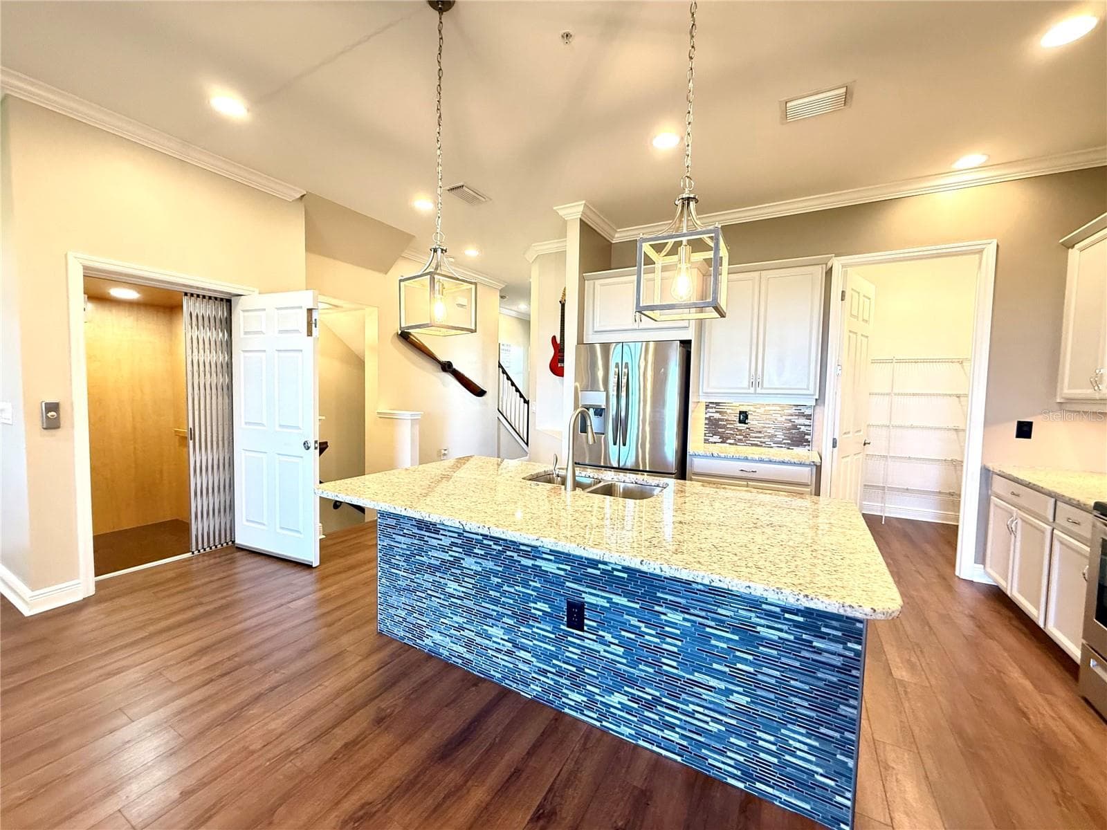 Note the elevator entry from the 4 car garage directly into the kitchen, makes putting groceries away simple! - 10320 LANDS END CIR #47, PLACIDA