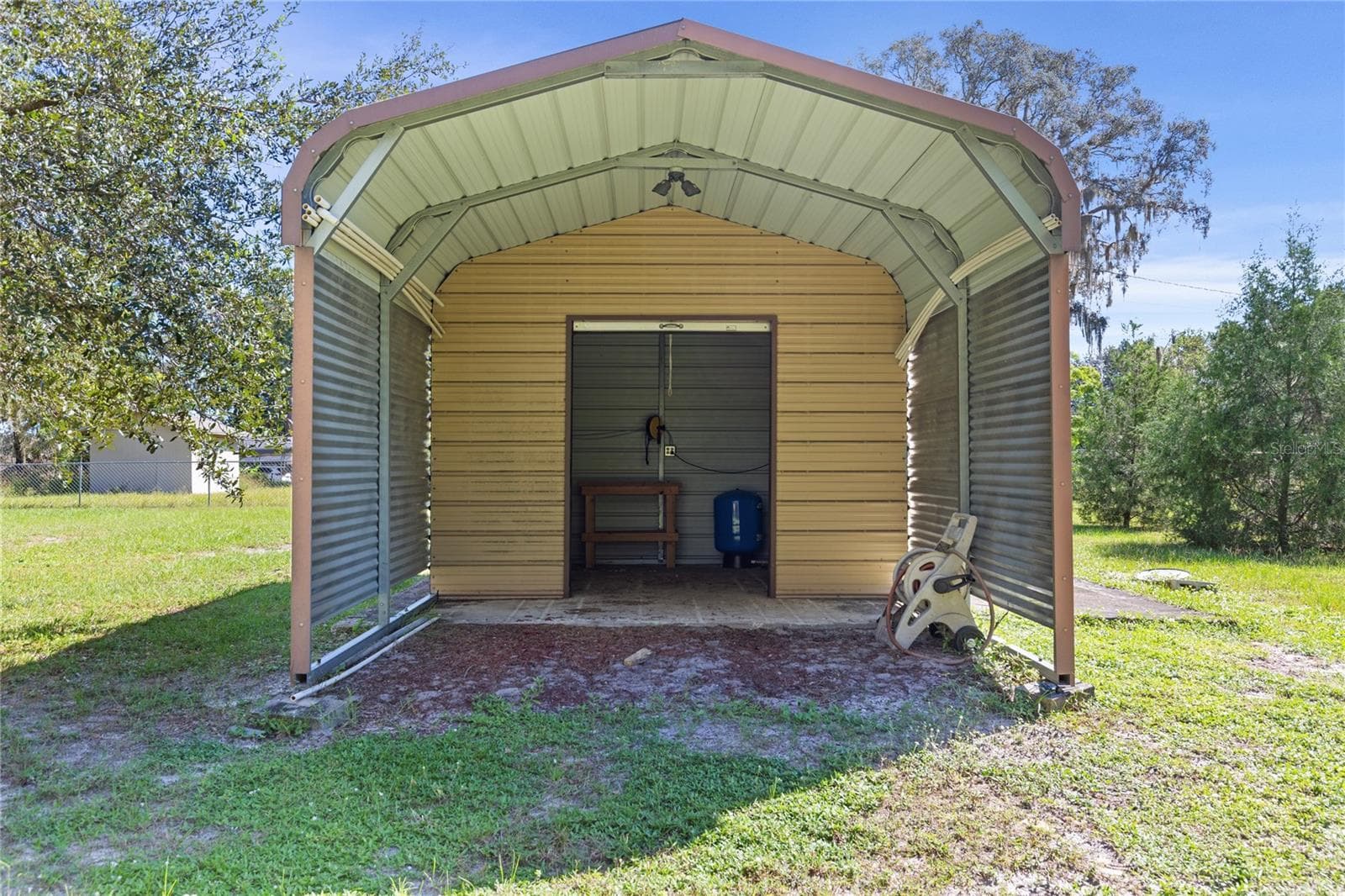Shed/well on adjacent lot - 10179 FRIERSON LAKE DR, HUDSON
