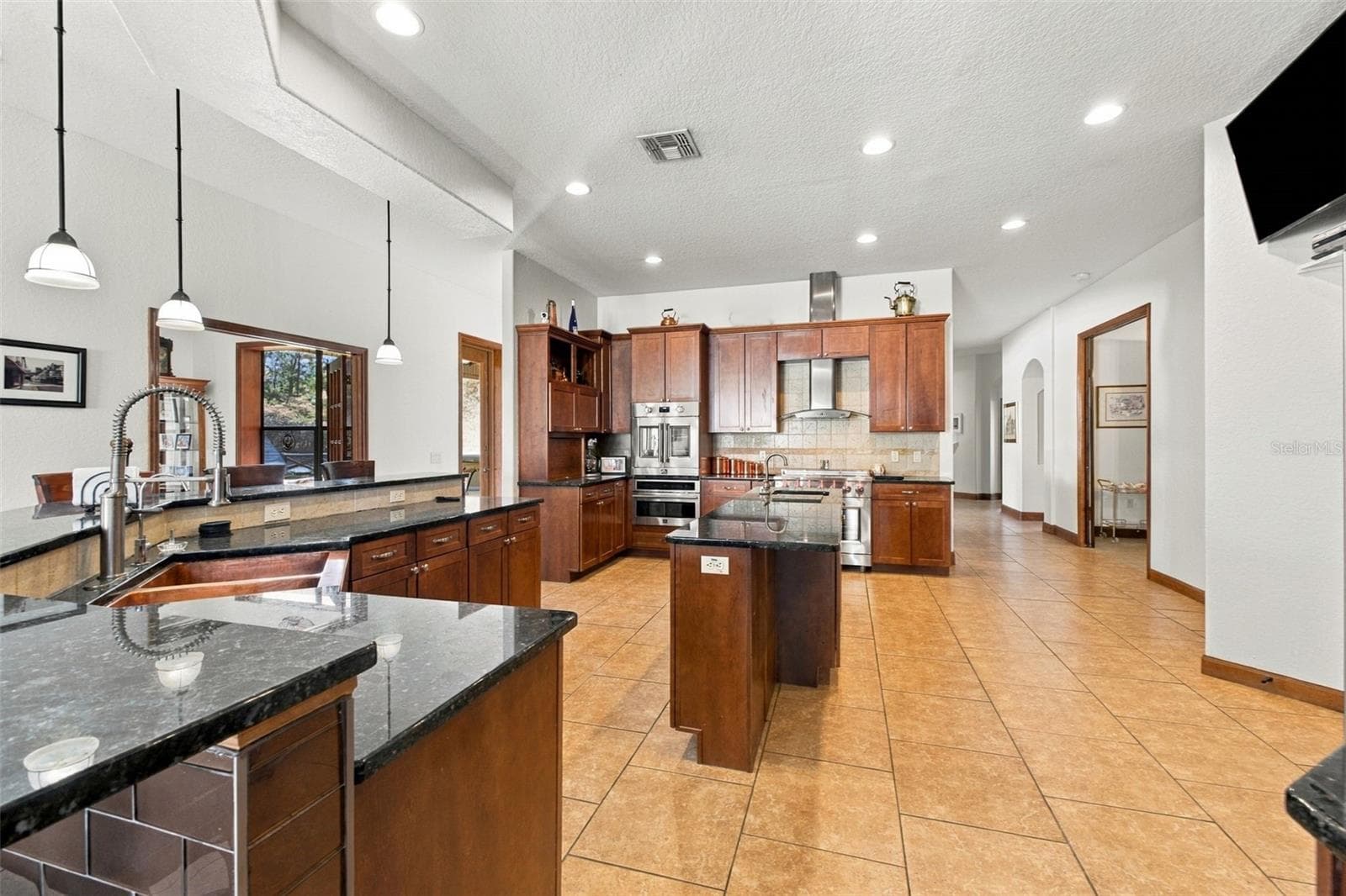 KITCHEN WITH LARGE ISLAND - 10484 GYPSY AVE, WEEKI WACHEE