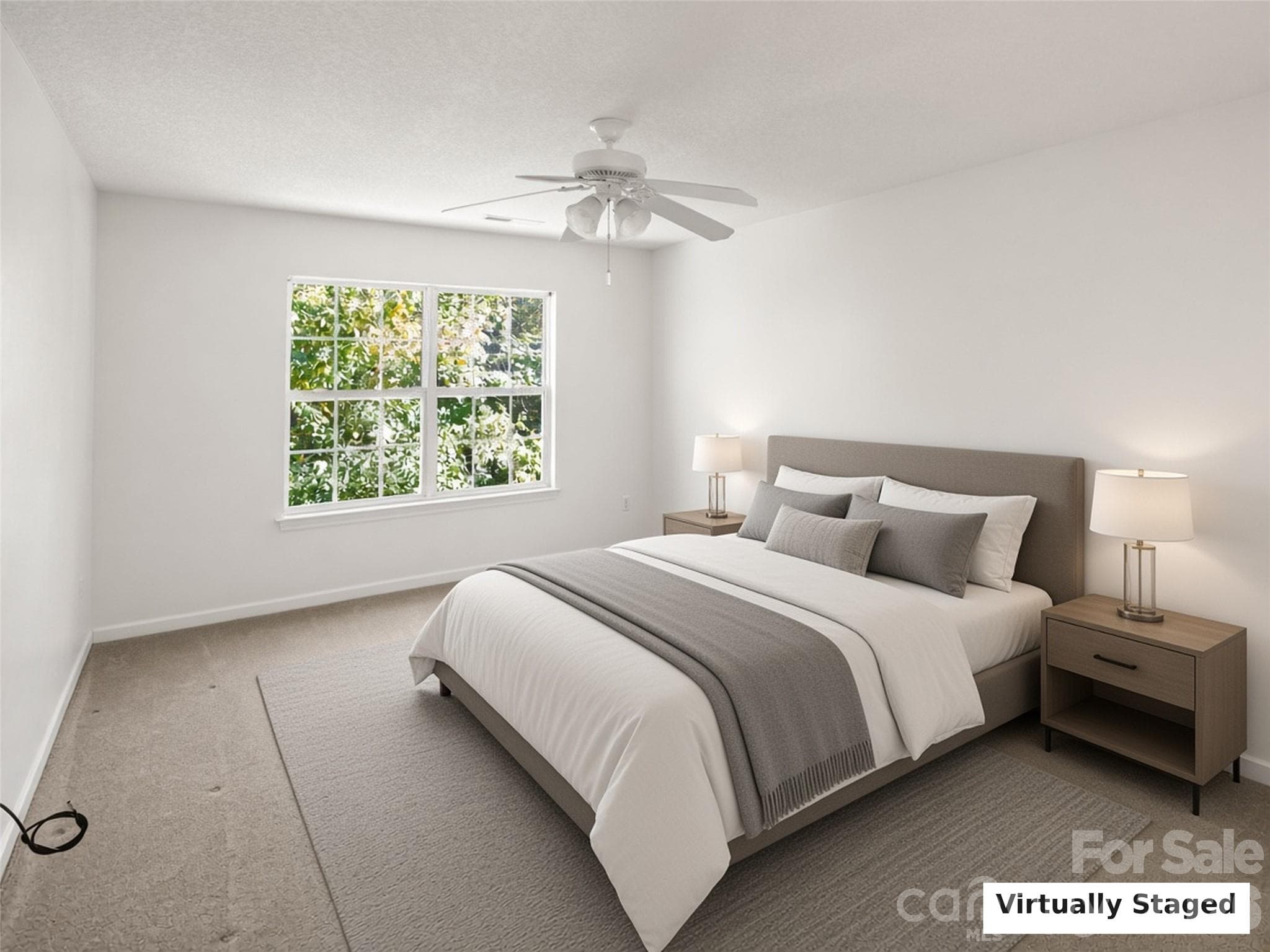 Virtually Staged. Bedroom with ceiling fan and wooded views. - 206 Waters Edge Drive, Weaverville