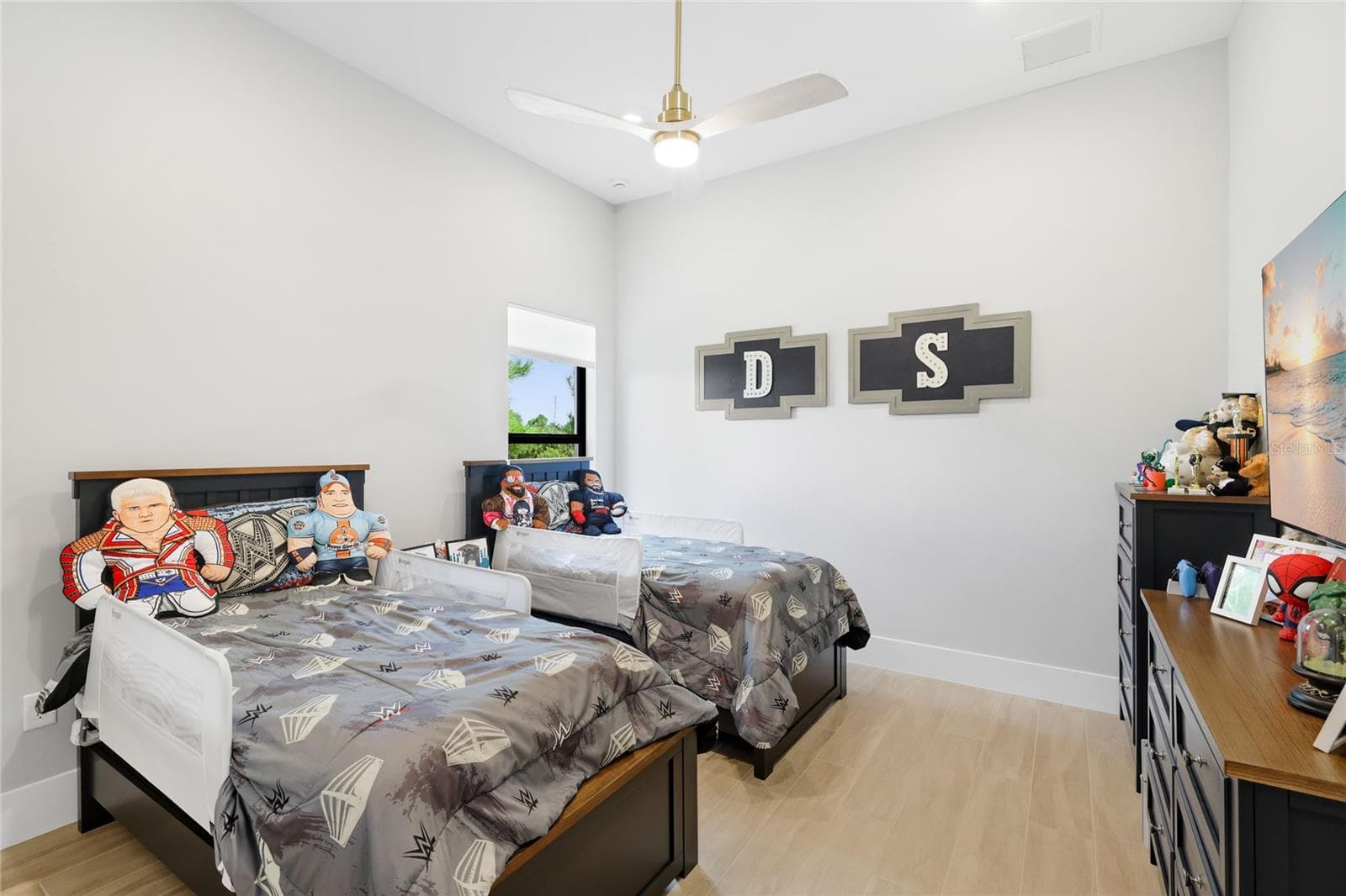 Bedroom 4 with ceiling fan and built-in closet with lighting. - 14726 EAGLE BRANCH DR, NOKOMIS