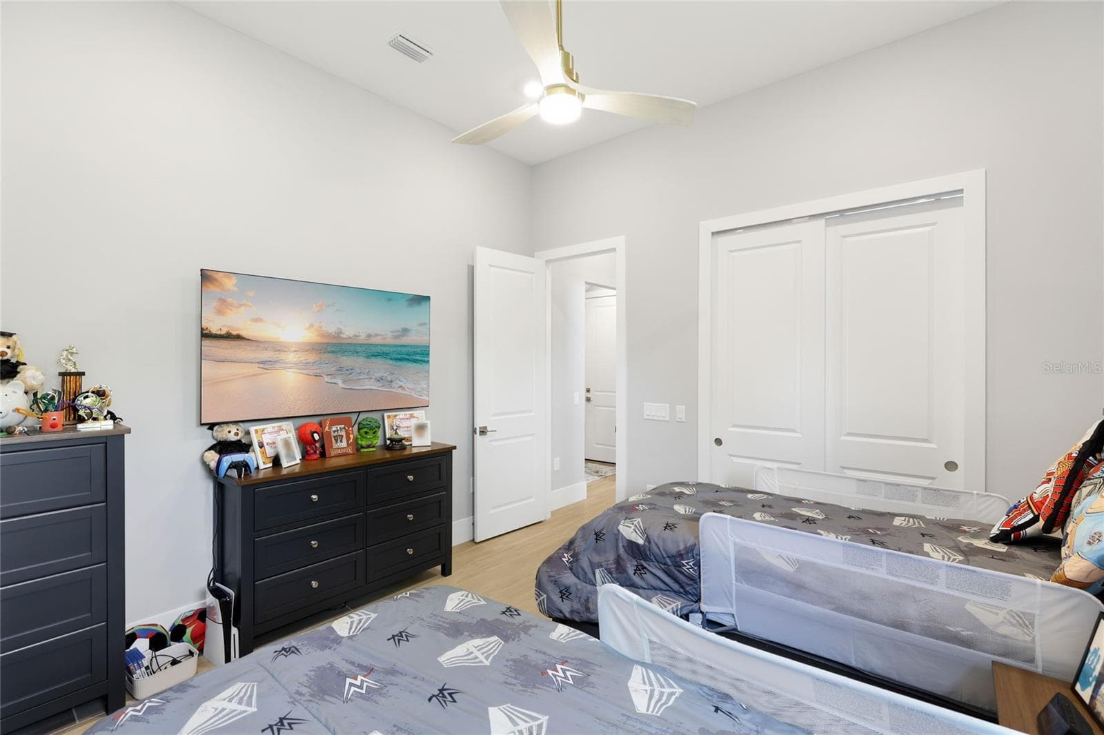 Bedroom 4 with ceiling fan, built-in closet with lighting. - 14726 EAGLE BRANCH DR, NOKOMIS