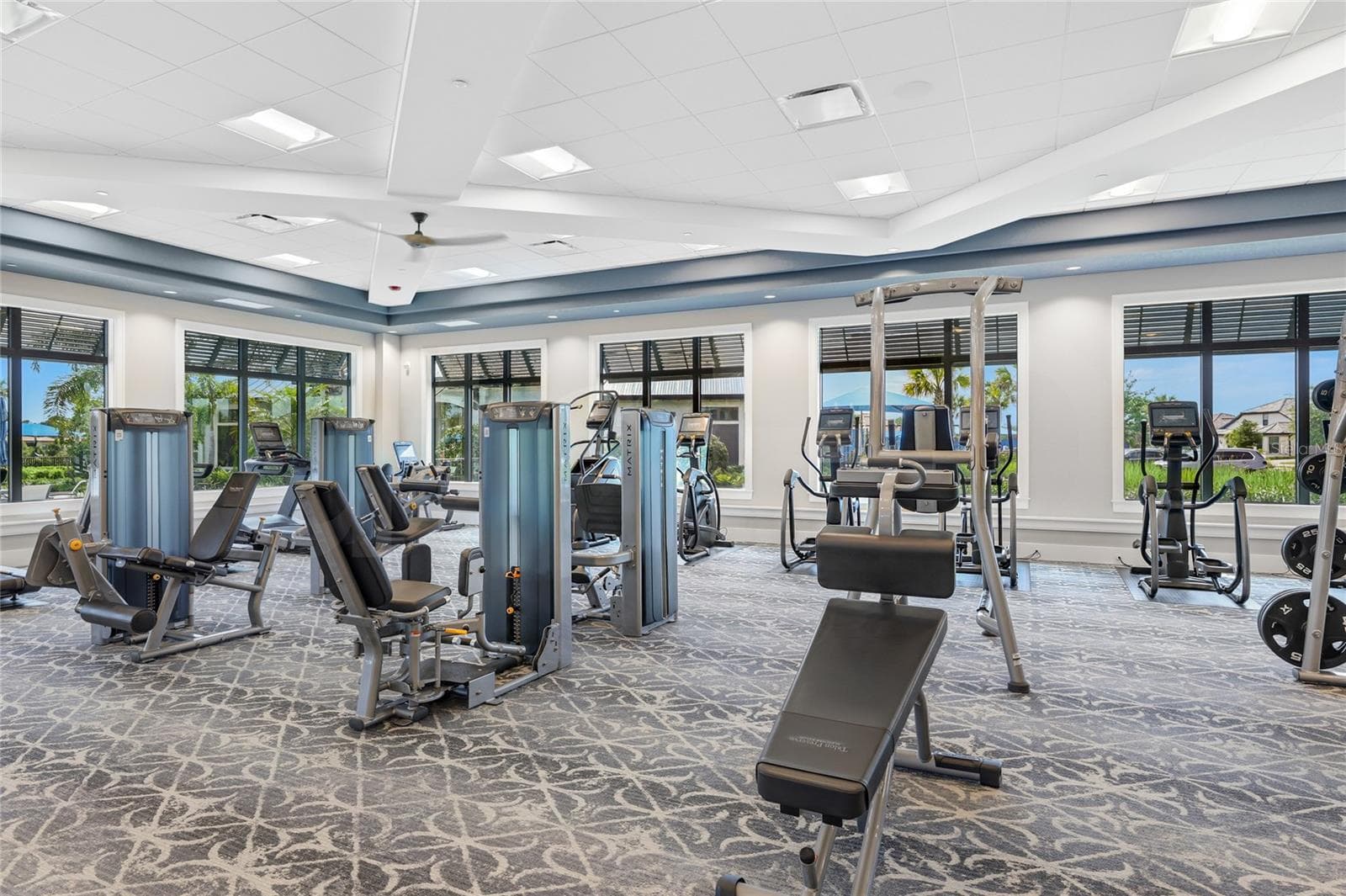 Fitness Center overlooking the resort style pool. - 14726 EAGLE BRANCH DR, NOKOMIS