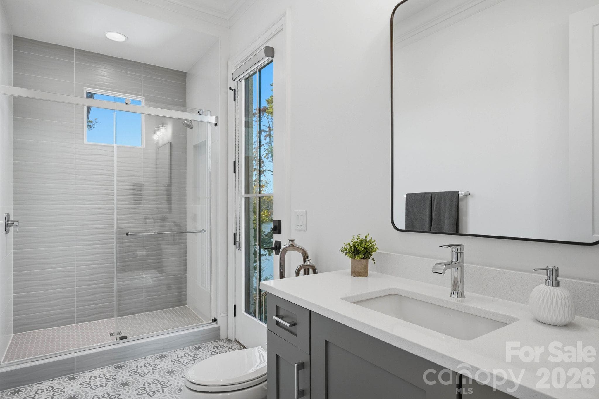 Full bathroom accessible from the pool and backyard as well as the laundry room / drop zone - 1016 Timberlake Point, Belmont