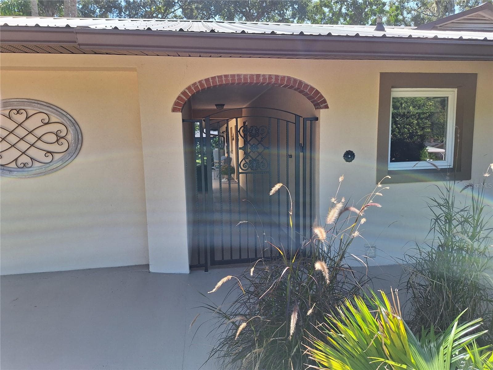 Gate leading to home. - 456 W 10TH AVE, MOUNT DORA