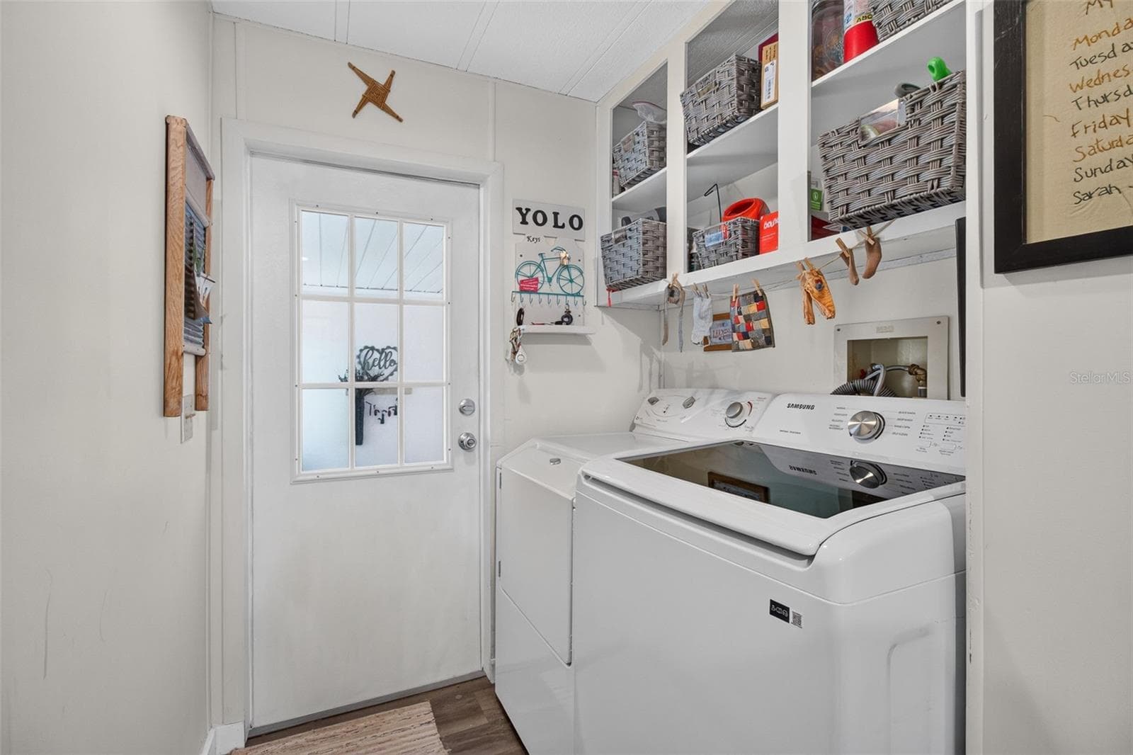 Interior laundry with door to front room, entry. - 176 CLUBVIEW DR #3, SAFETY HARBOR