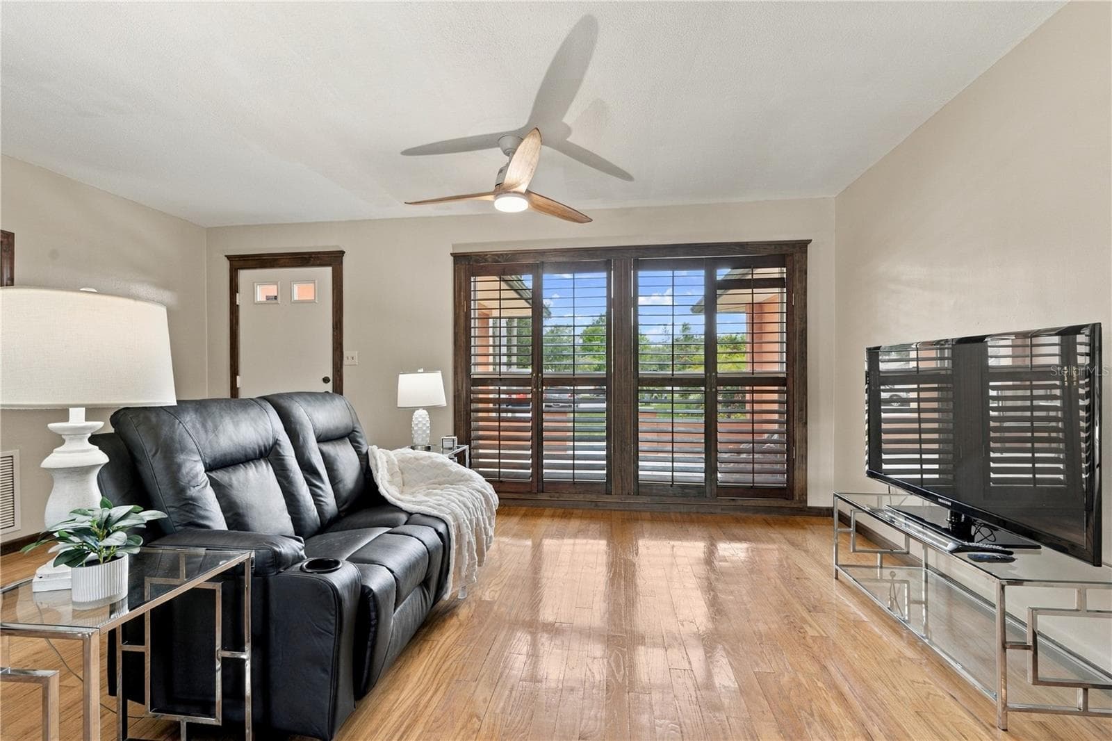 11. Front Living Room is (12.7 x 15') .. with Wood Shutters for a Touch of Elegance! - 112 PEACOCK CIR, SAFETY HARBOR