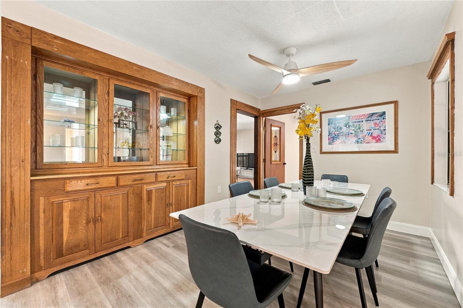 18. Dining Area (12.8 x 9') Has a Gorgeous Solid Wood Custom Built In Hutch for Your Dinnerware.. - 112 PEACOCK CIR, SAFETY HARBOR