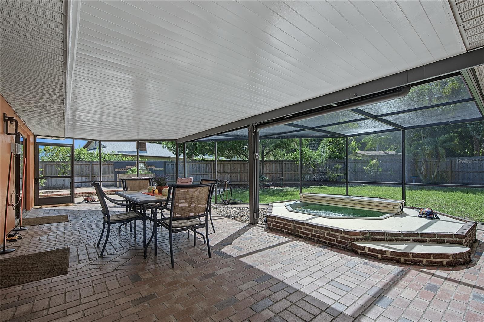 32. HUGE Enclosed, Covered, Screened Lanai w Brick Paved Flooring.. Hot Tub.. GREAT VIEW of Your PRIVATE Backyard! - 112 PEACOCK CIR, SAFETY HARBOR