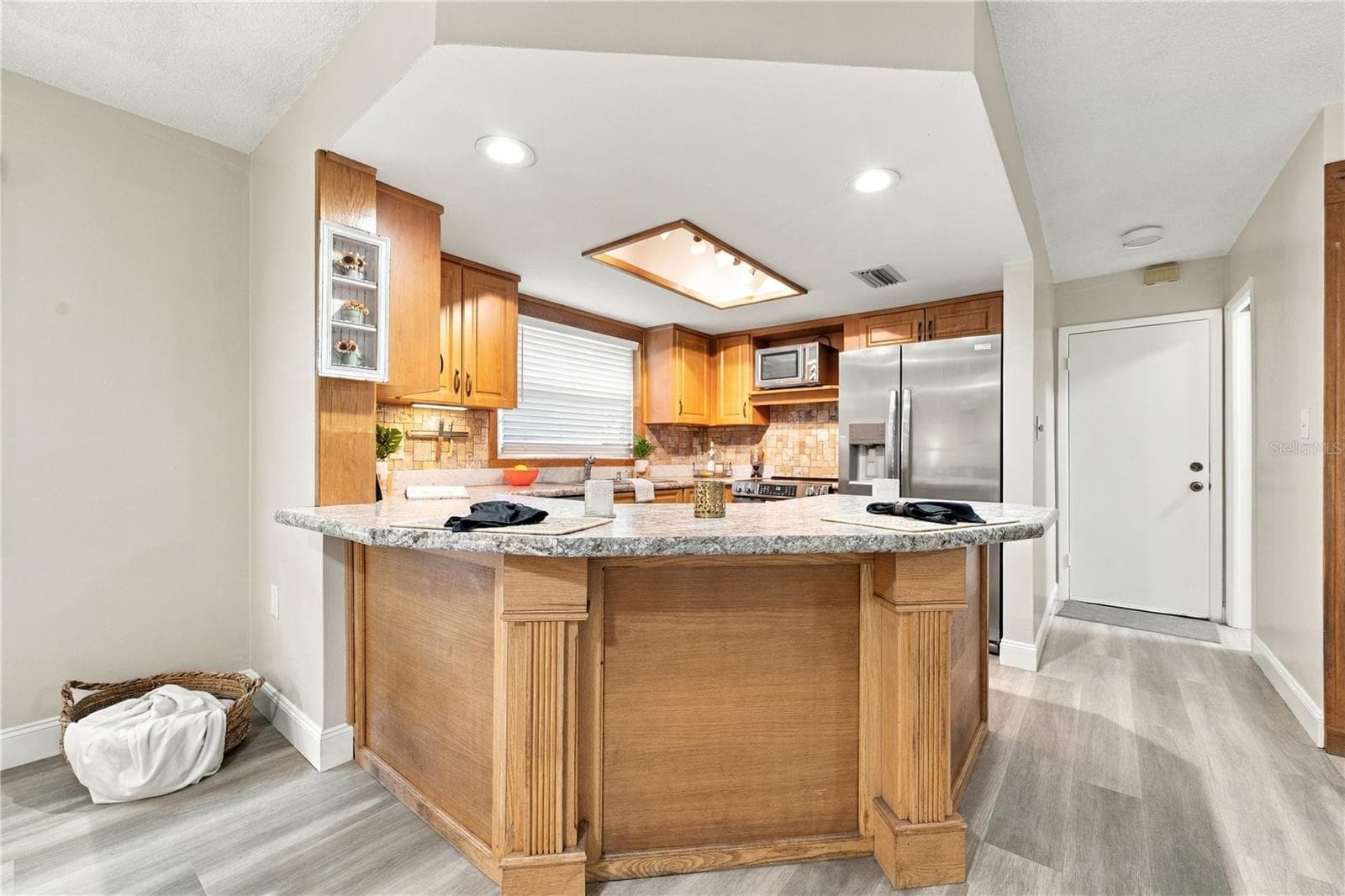 49. Updated Kitchen (9.4 x 12.2') w Durable Attractive Laminate Counters, New Recessed Lights, Plenty of Counterspace.. - 112 PEACOCK CIR, SAFETY HARBOR
