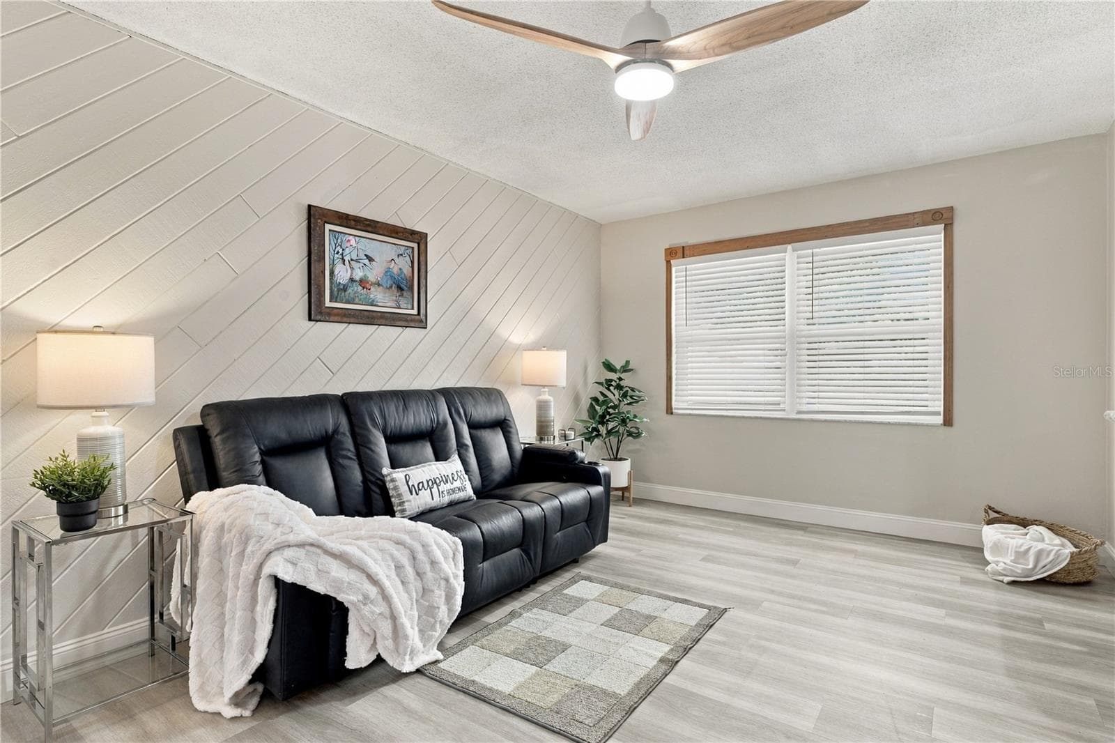 55. Family Room (18.9 x 10.10') with Awesome Wood Accent Wall, Slats Running Diagonally - Creating Visual Interest!! - 112 PEACOCK CIR, SAFETY HARBOR