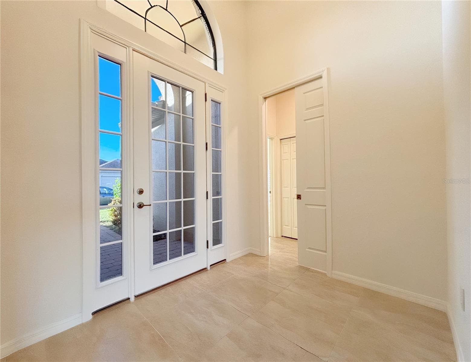 Tiled Entry with Glass Eyebrow Window Above - 6240 PINEHURST LOOP, WINTER HAVEN