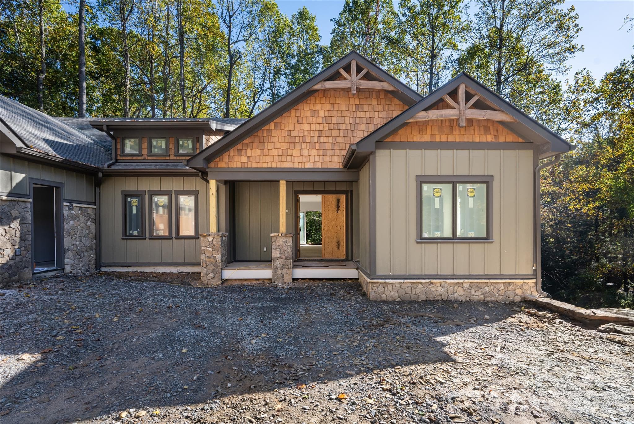 A covered front porch with a double front door. - 200 Bent Pine Trace, Hendersonville