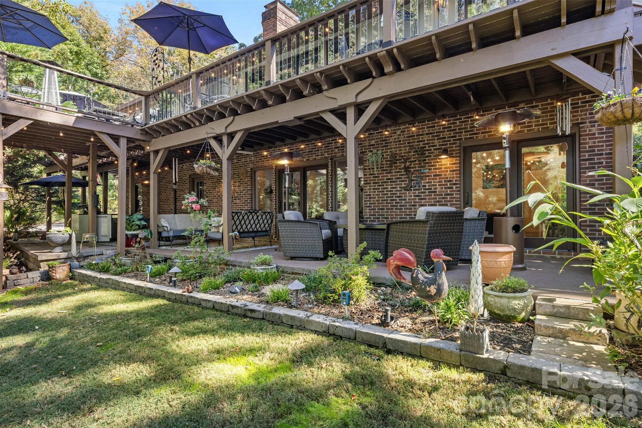 More covered deck space with custom hardscape design - 4 Thornwood Lane, Lake Wylie