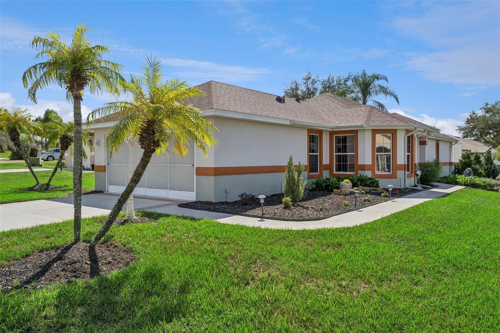 The Front faces Seven Seas Dr, with the driveway entrance from Canoe Ct. - 4900 CANOE CT, TAVARES