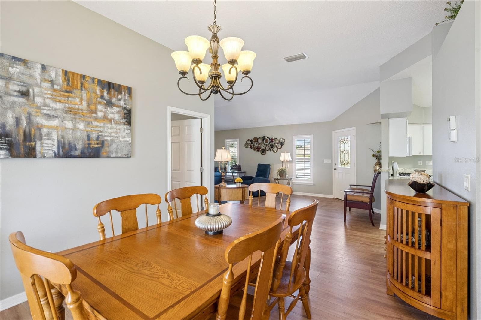 Dining Room French doors open to the second screened lanai. - 4900 CANOE CT, TAVARES