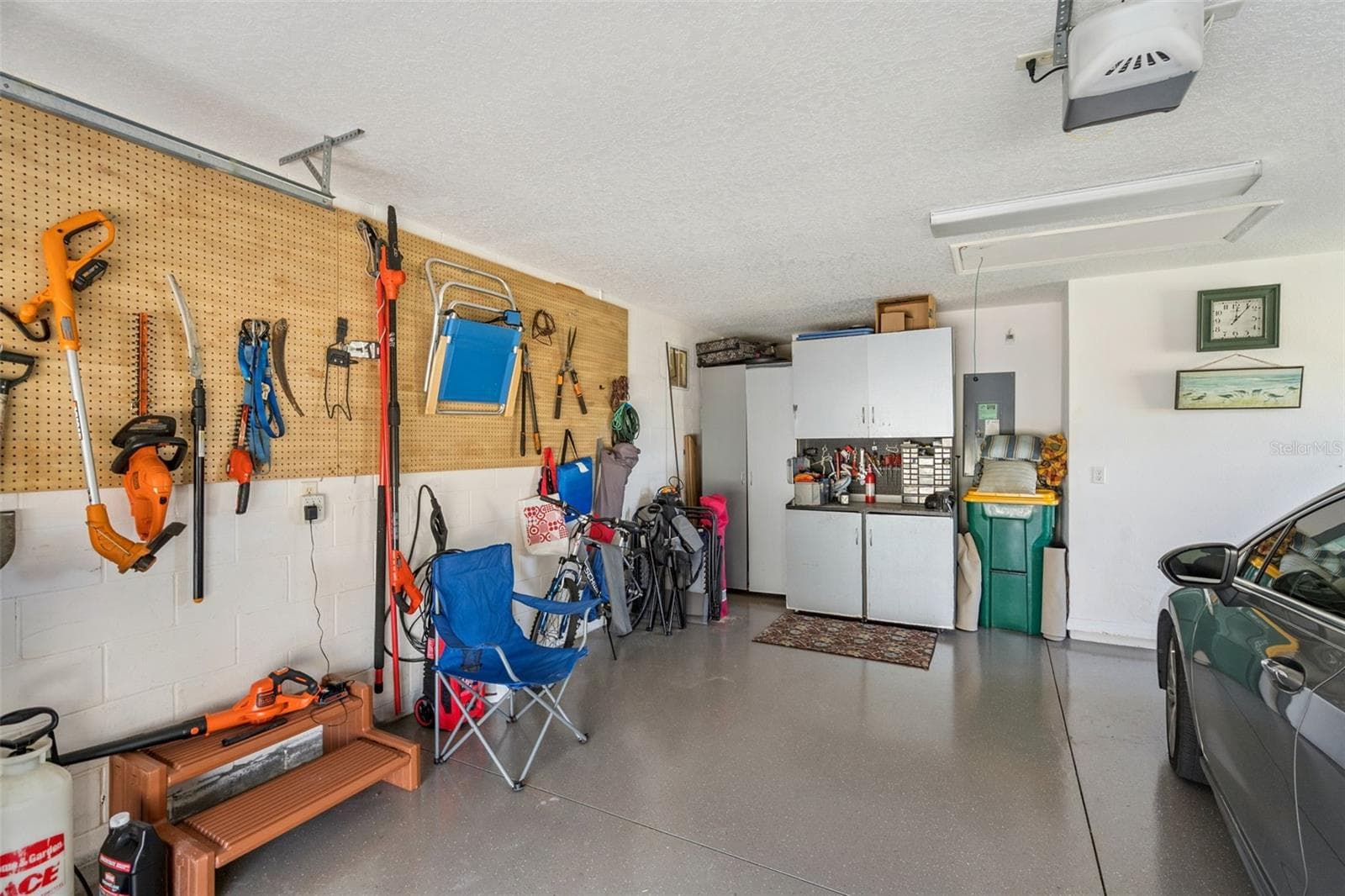 Garage with room for a workbench and storage. - 4900 CANOE CT, TAVARES