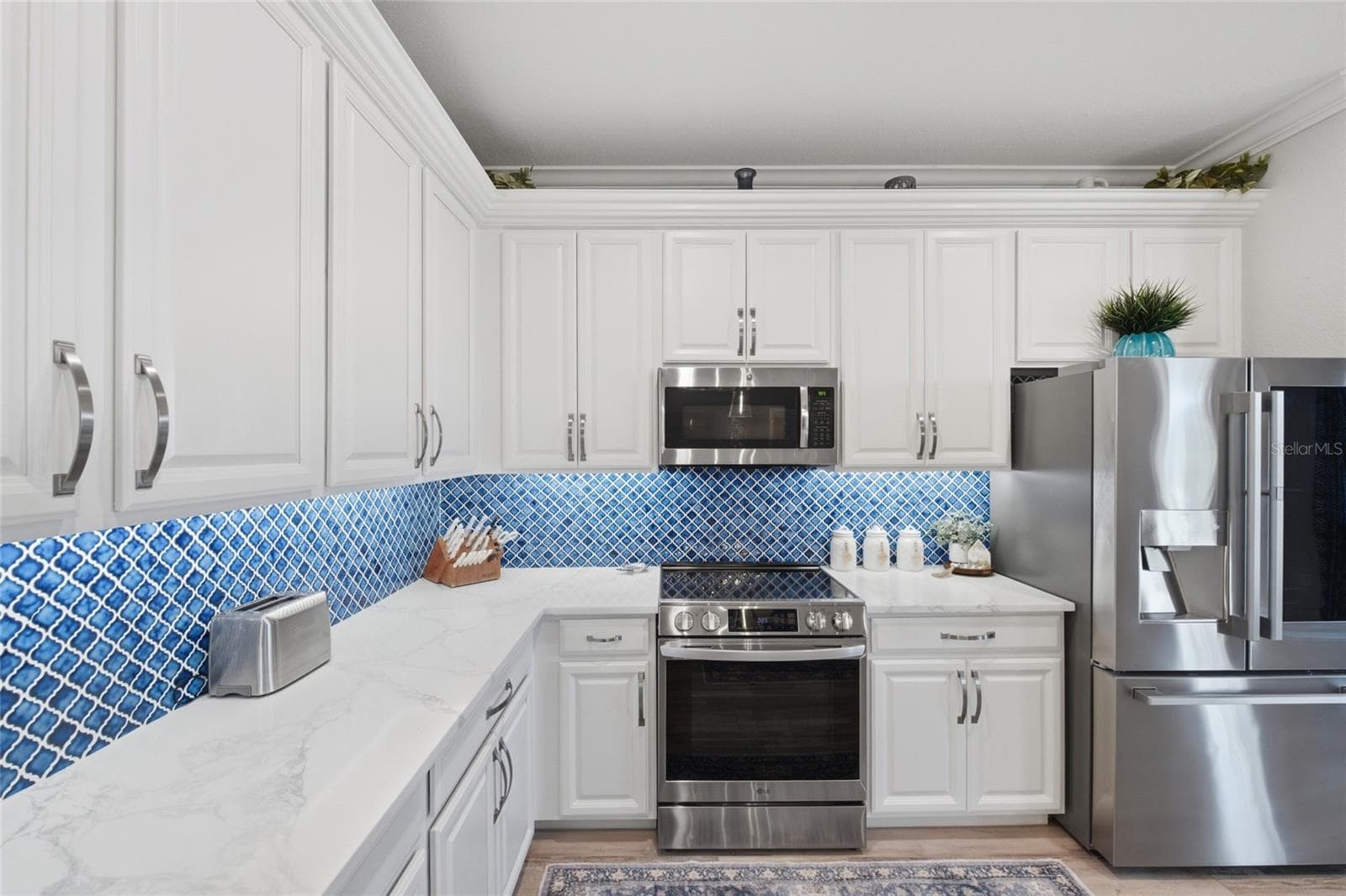 Kitchen with Stainless Steel Appliances - 6726 ROOKERY LAKE DR, BRADENTON
