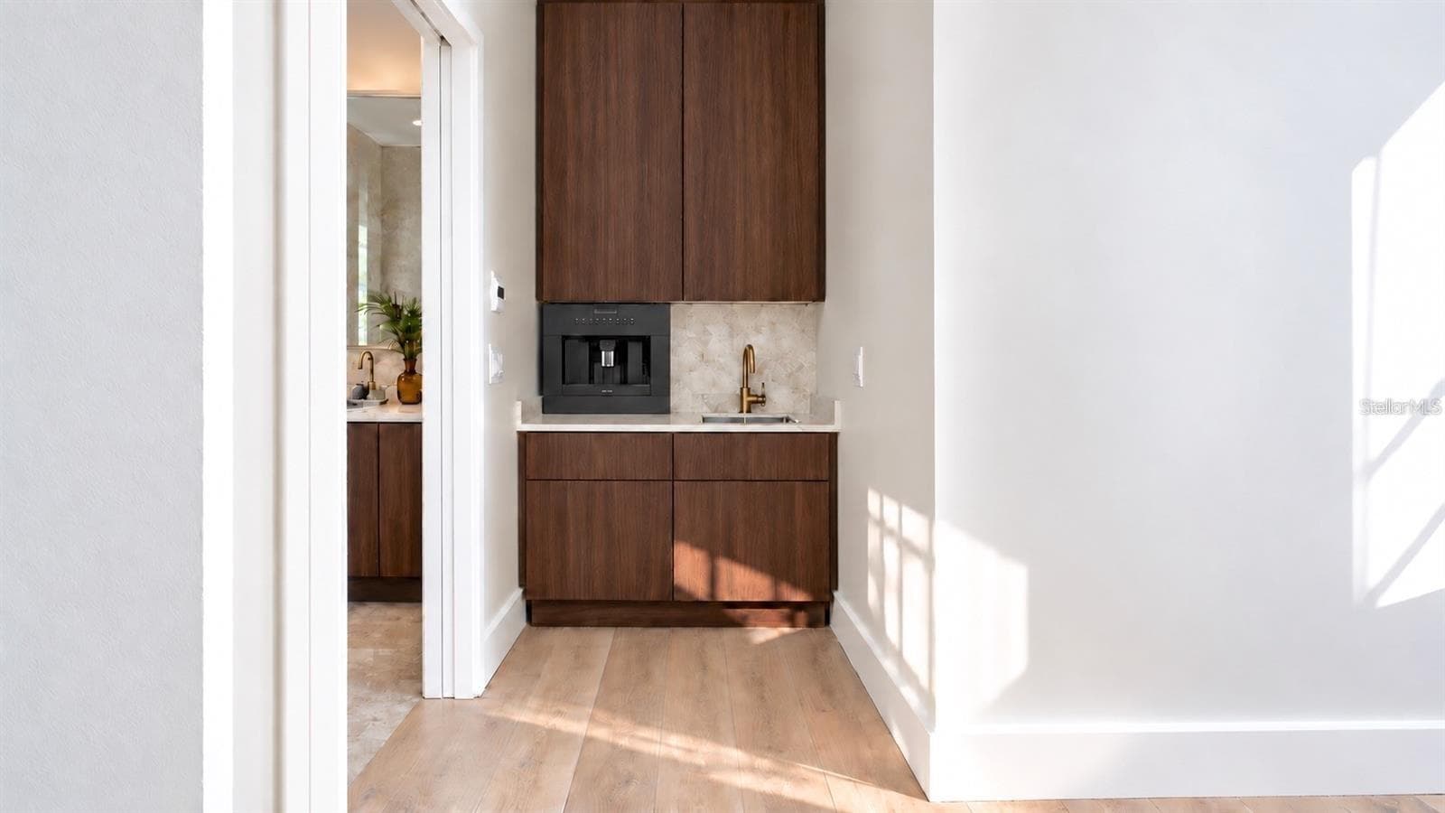 Wet bar for the primary bedroom, with virtual staging. - 838 NORSOTA WAY, SARASOTA