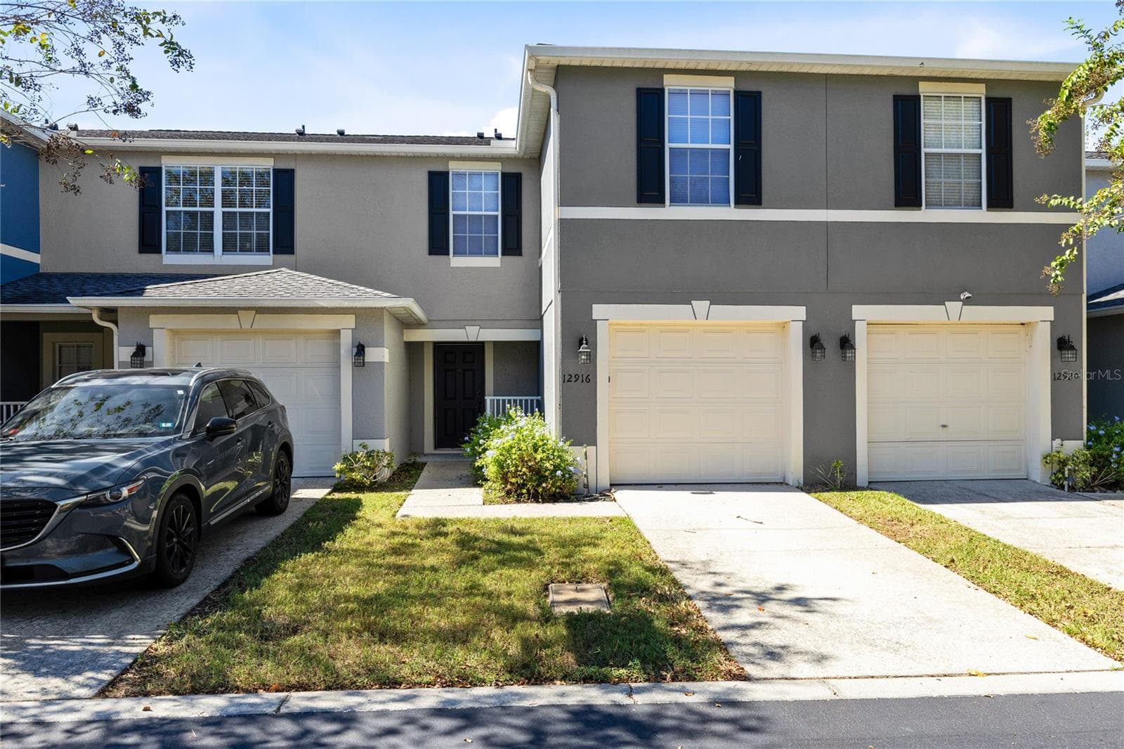 Front entrance with garage - 12916 LEXINGTON SUMMIT ST, ORLANDO