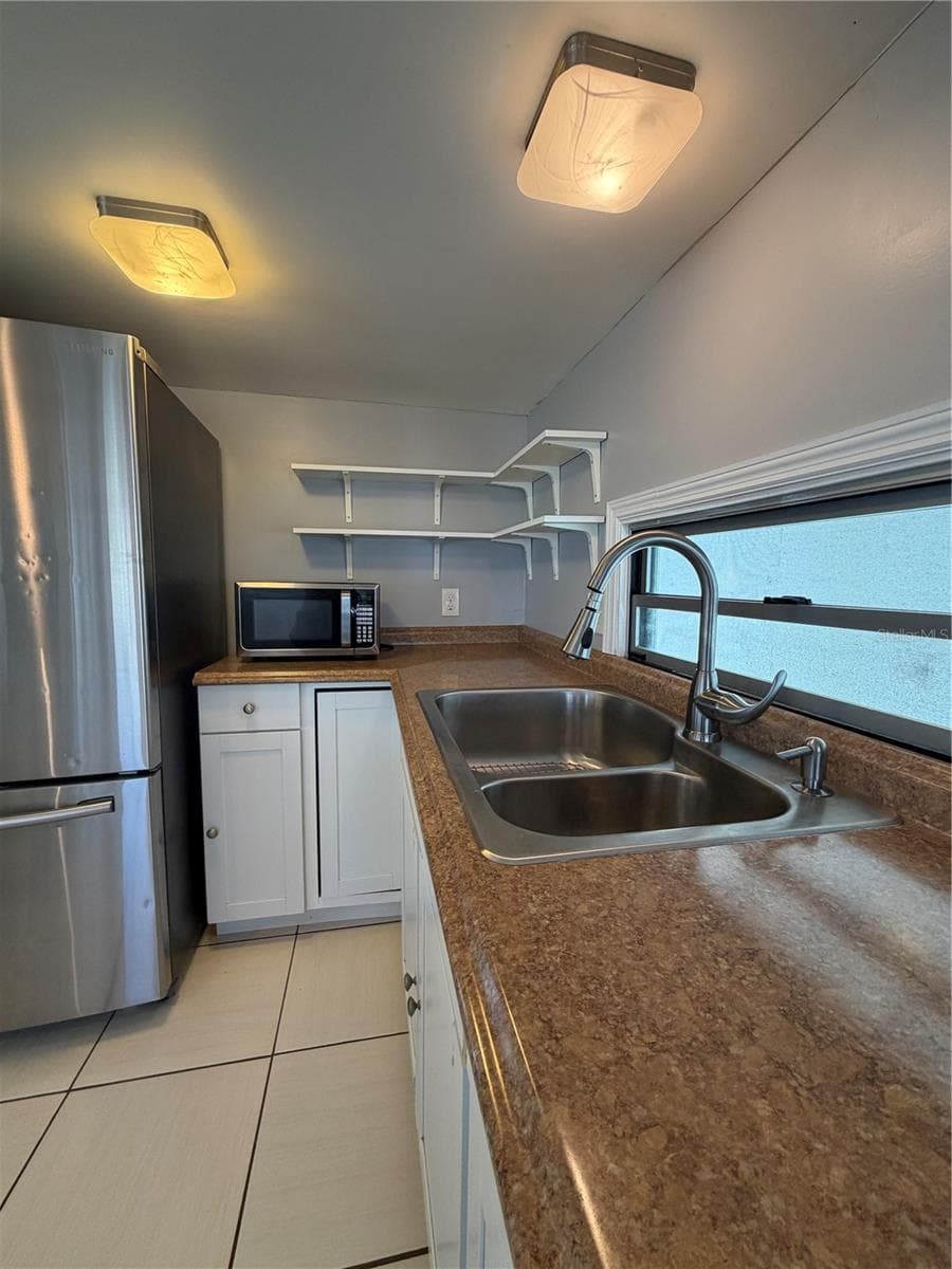 Kitchen with update lighting. - 4120 BUENA VISTA LN, HOLIDAY