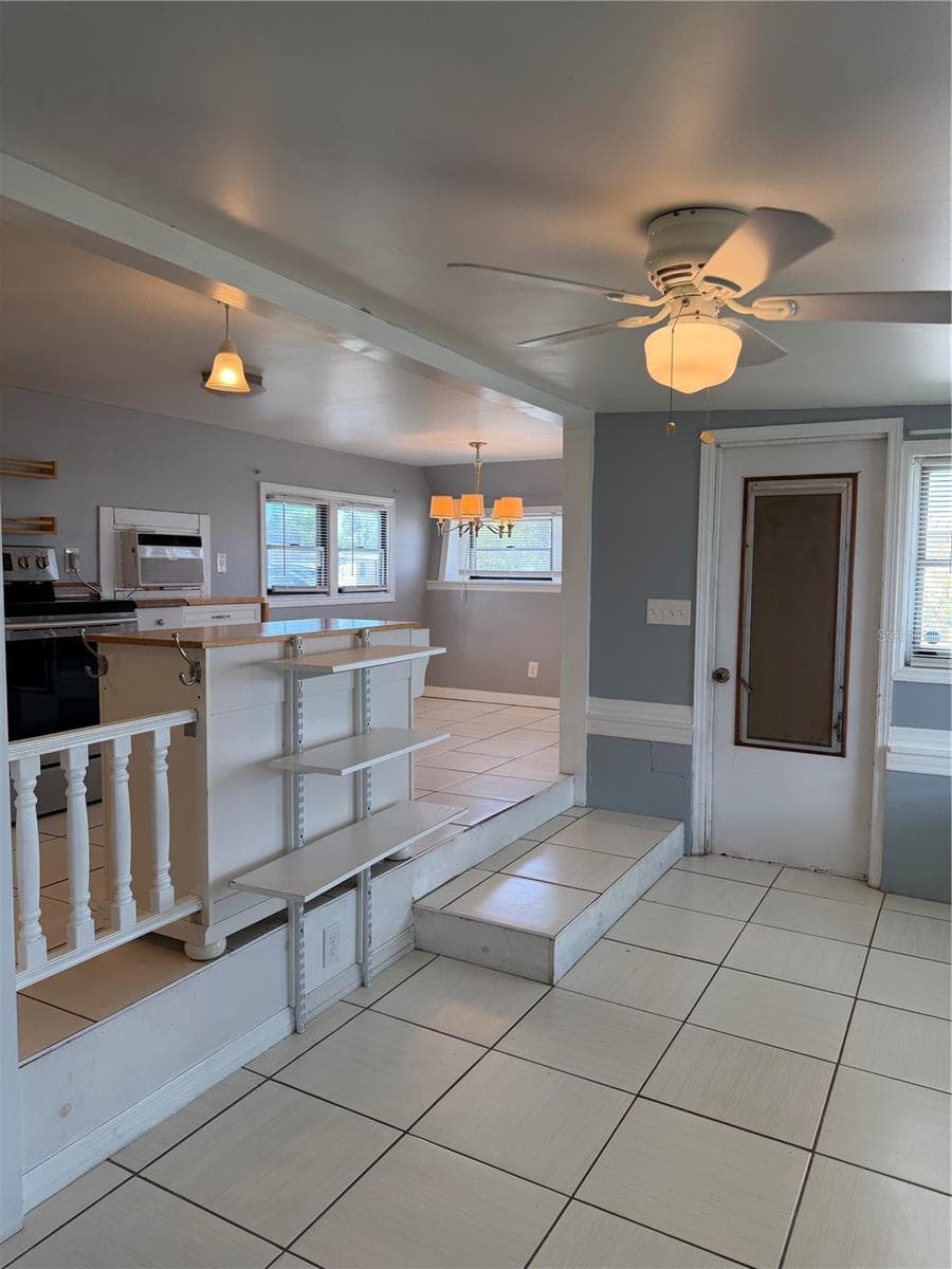 Front door and view into the eat in kitchen. - 4120 BUENA VISTA LN, HOLIDAY