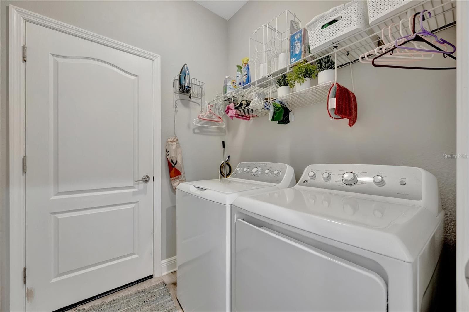 Separate laundry room leads to garage - 11115 SAND PINE LN, PARRISH