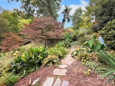 Stone path on the west side of the home - 91 Worsham Drive, Waynesville