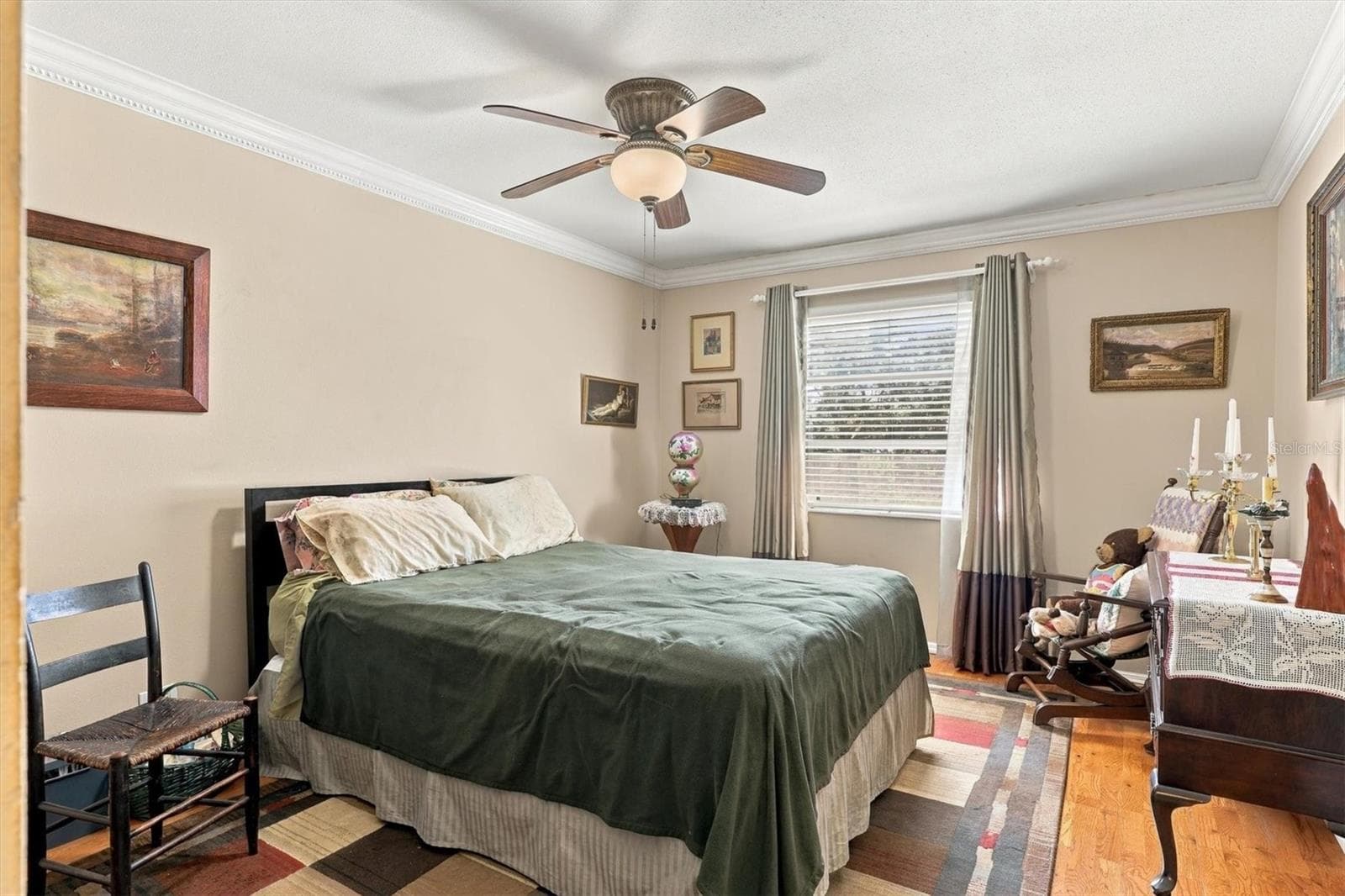 large bedroom with window and hard wood floors - 3950 ROXANE BLVD #3B, SARASOTA