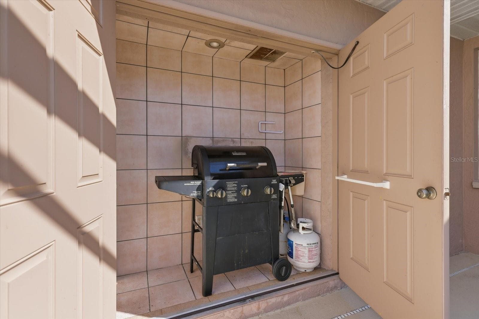 grill storage with double doors. - 9348 SAN BERNANDINO AVE, ENGLEWOOD