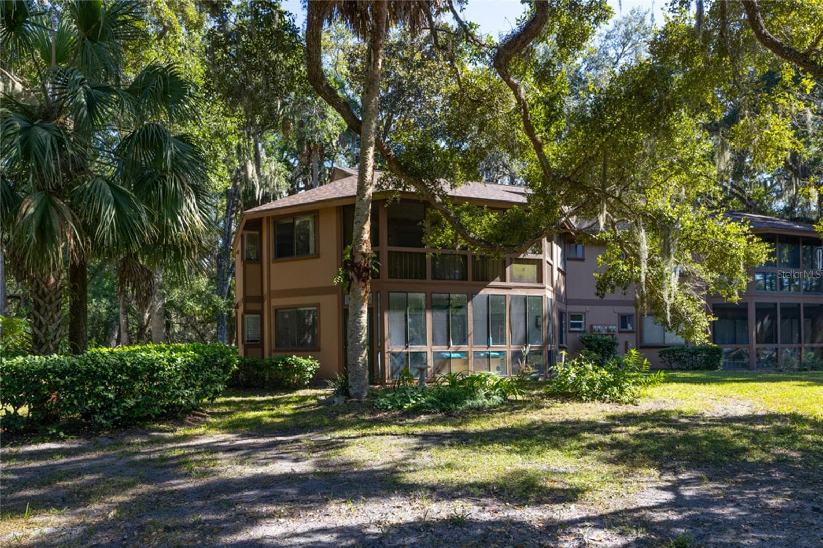 Unit overlooks Palm Harbor Golf Course through mature trees - 12 FAIRWAYS CIR #12, PALM COAST