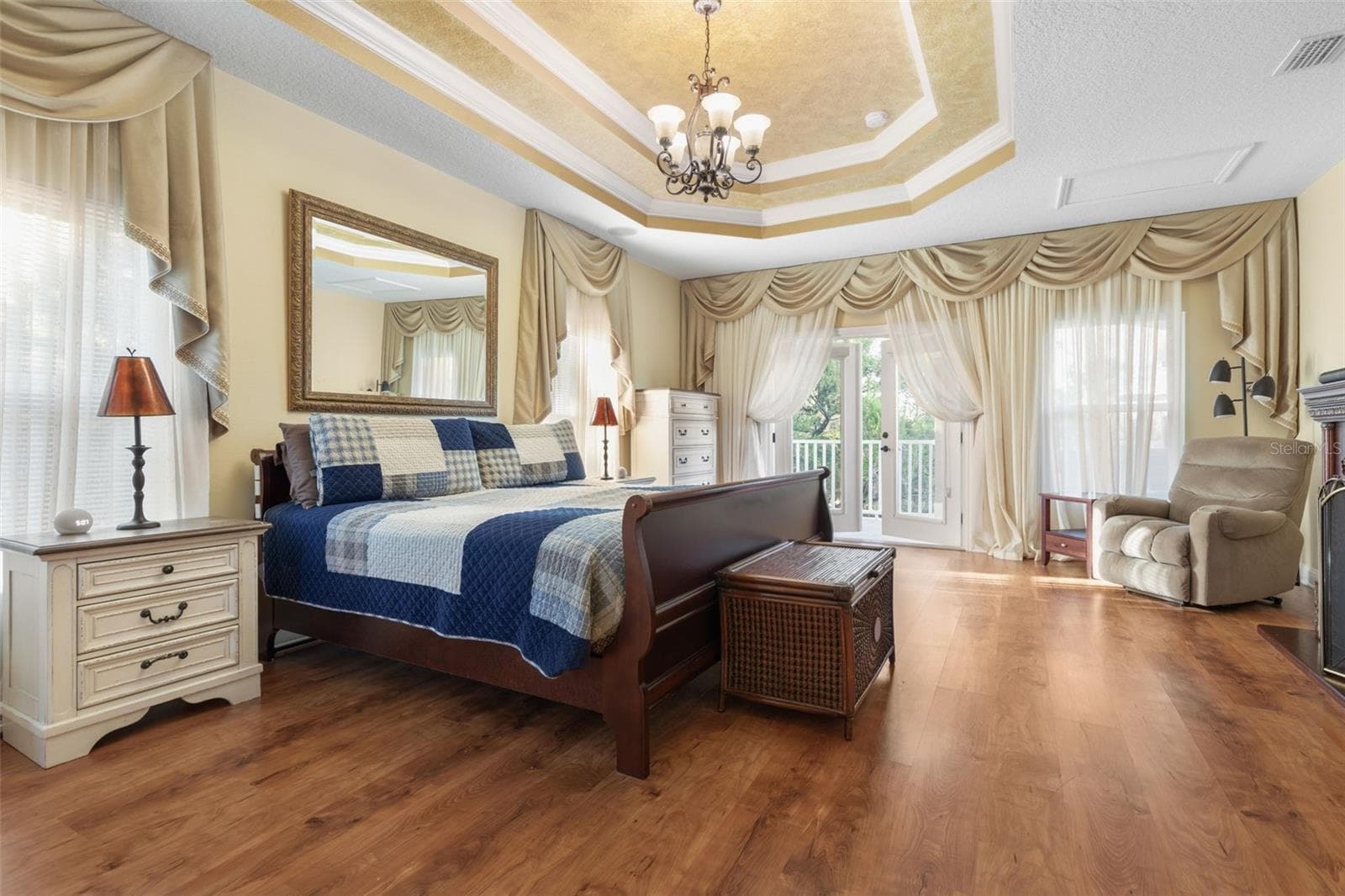 A versatile upstairs retreat currently used as a primary bedroom, offering a private space to relax and unwind. - 25 EMERALD LAKE CT, PALM COAST