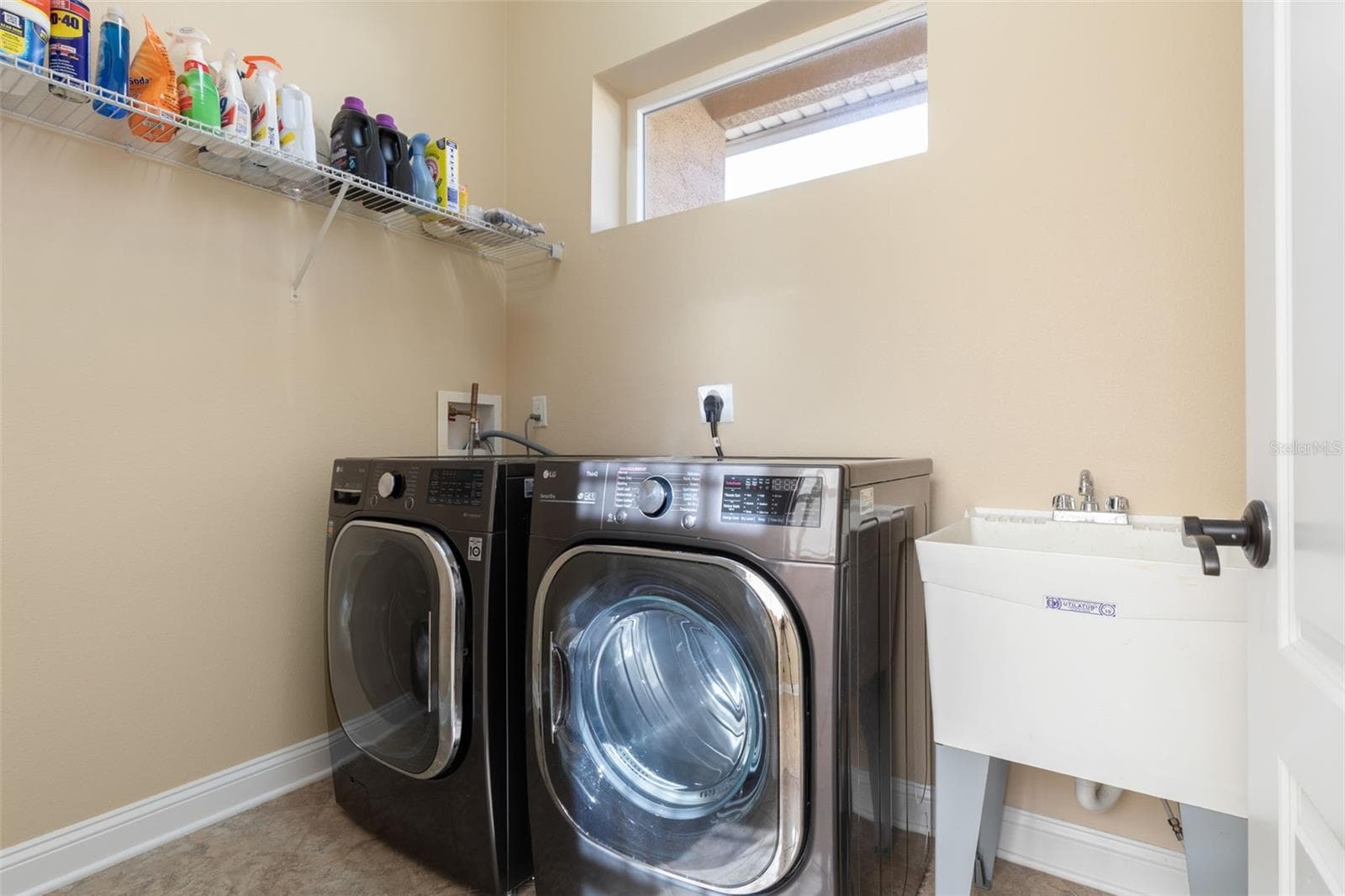 Convenient Indoor Laundry Room with Washer, Dryer & Utility Sink - 25 EMERALD LAKE CT, PALM COAST