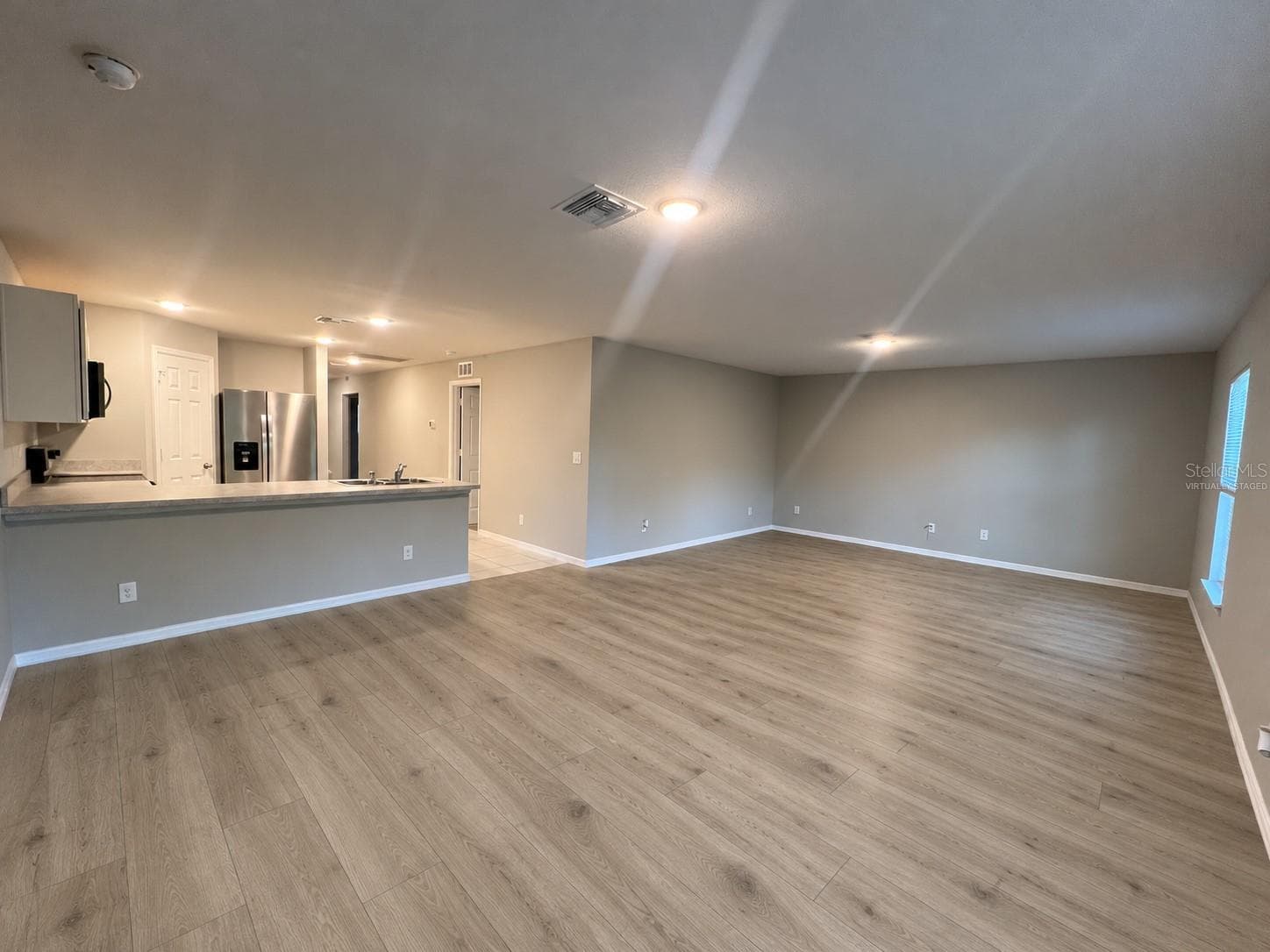 Living room and kitchen - 3404 61ST ST W, LEHIGH ACRES