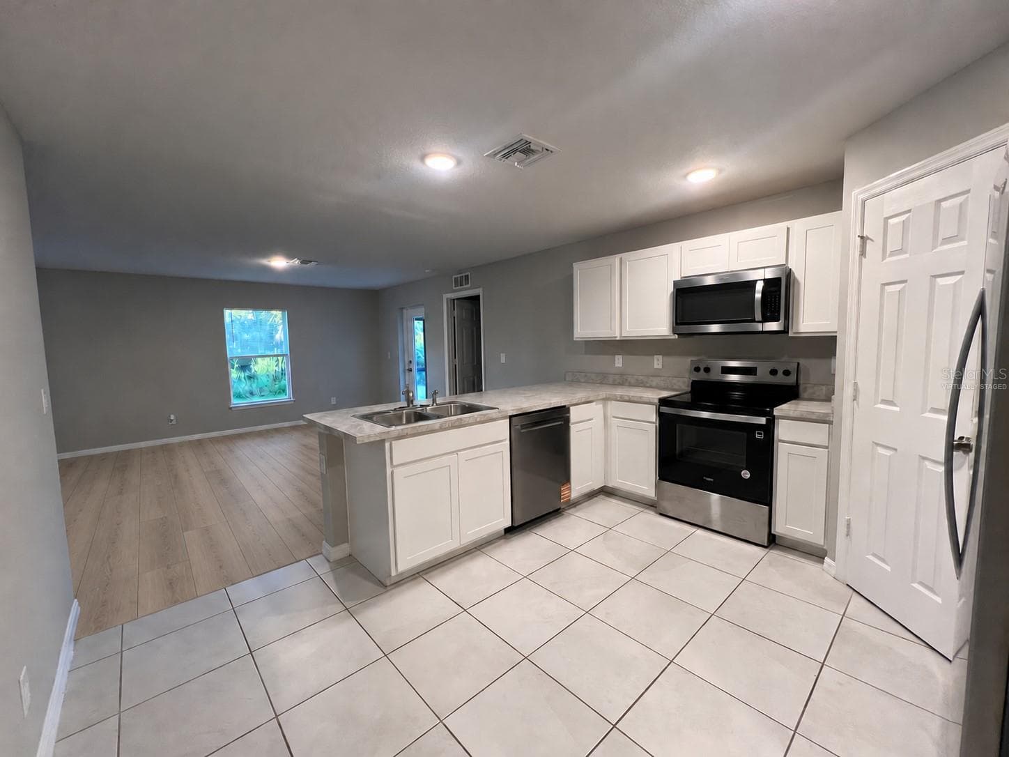 Kitchen and living area - 3404 61ST ST W, LEHIGH ACRES