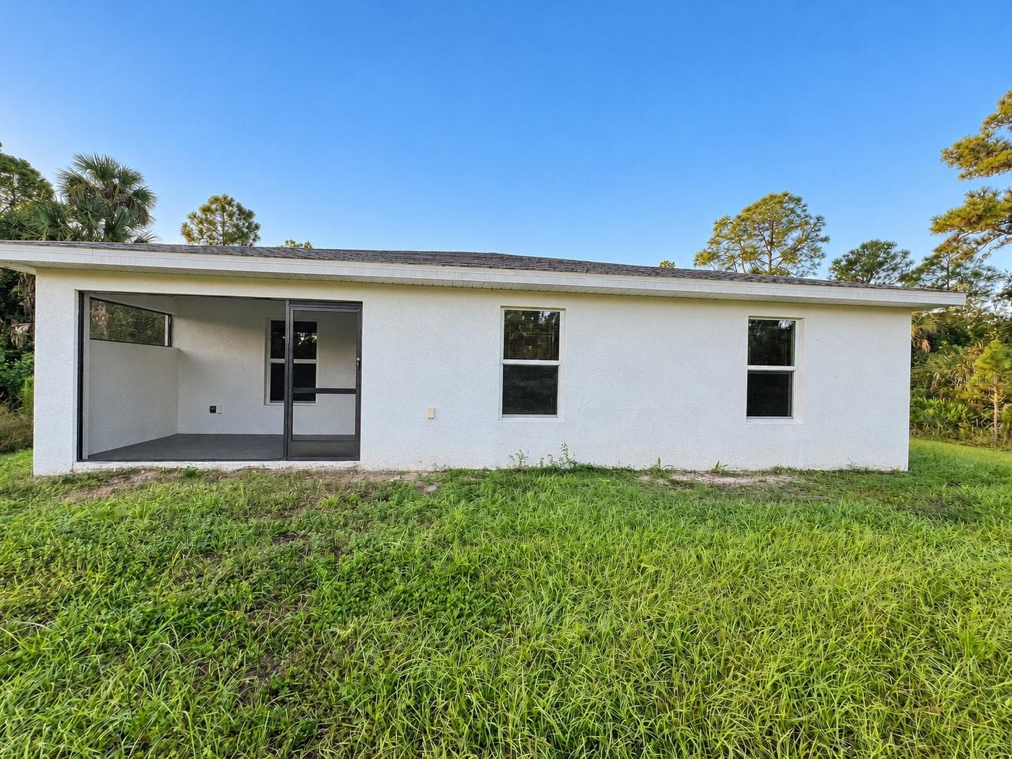 Rear exterior - 3404 61ST ST W, LEHIGH ACRES