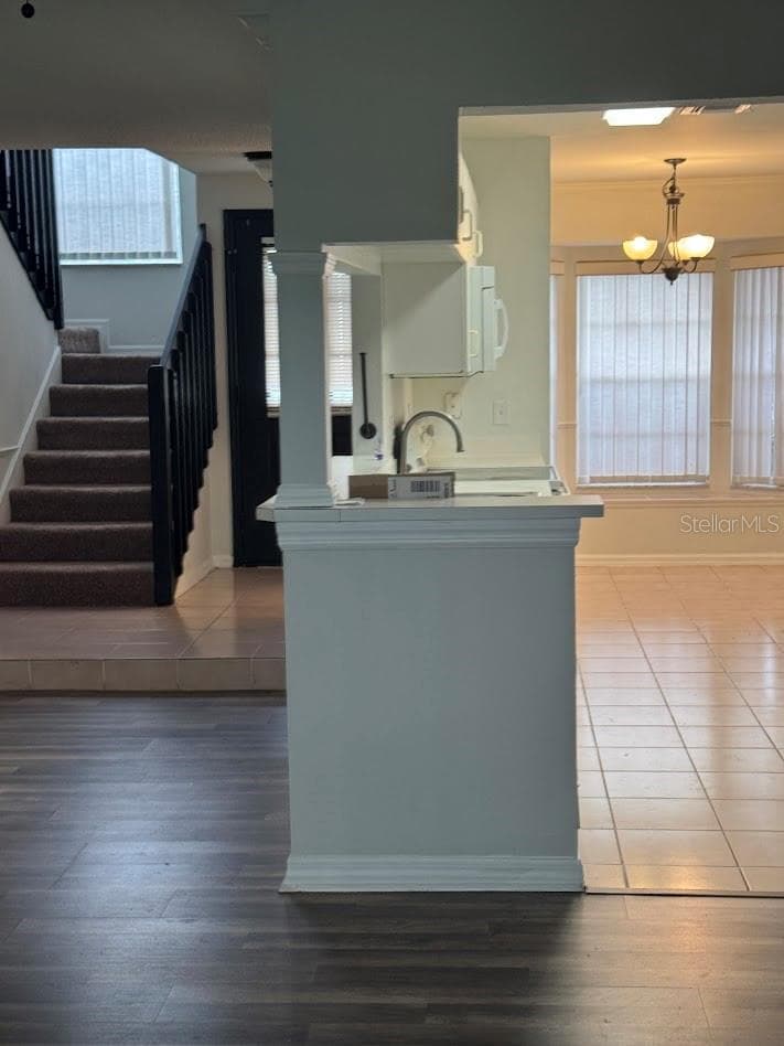 angled view of kitchen and stairs - 12144 BRUCETON WAY #101, ORLANDO