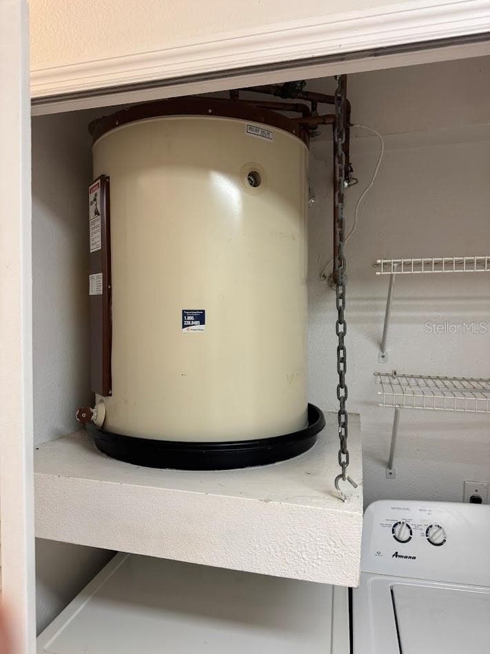 water heater all tucked away in kitchen - 12144 BRUCETON WAY #101, ORLANDO