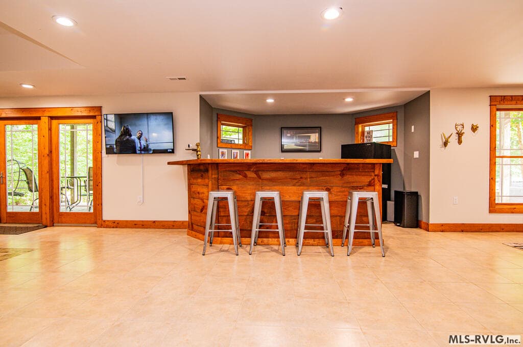 Ante Up & Let the Good Times Roll! , Gather around the poker table for cards, laughs and a little friendly competition—the perfect addition to this lake house entertainment space. - 243 Woodland Rd, Littleton NC 27850, Littleton