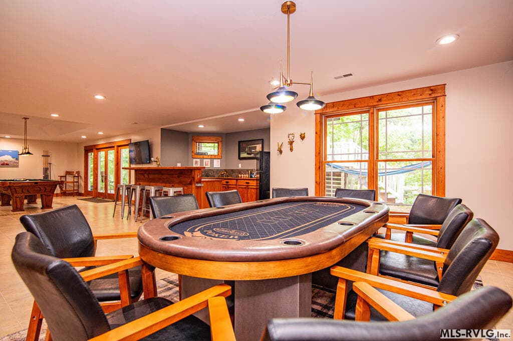 Spacious game room with pool table, arcade games, dedicated game area with huge poker table, wet bar - 243 Woodland Rd, Littleton NC 27850, Littleton