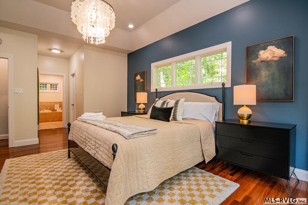 Primary Suite Retreat , Spacious and inviting primary bedroom with doors opening directly to the lakeside deck—perfect for stepping outside and starting your morning surrounded by the peaceful lake setting - 243 Woodland Rd, Littleton NC 27850, Littleton